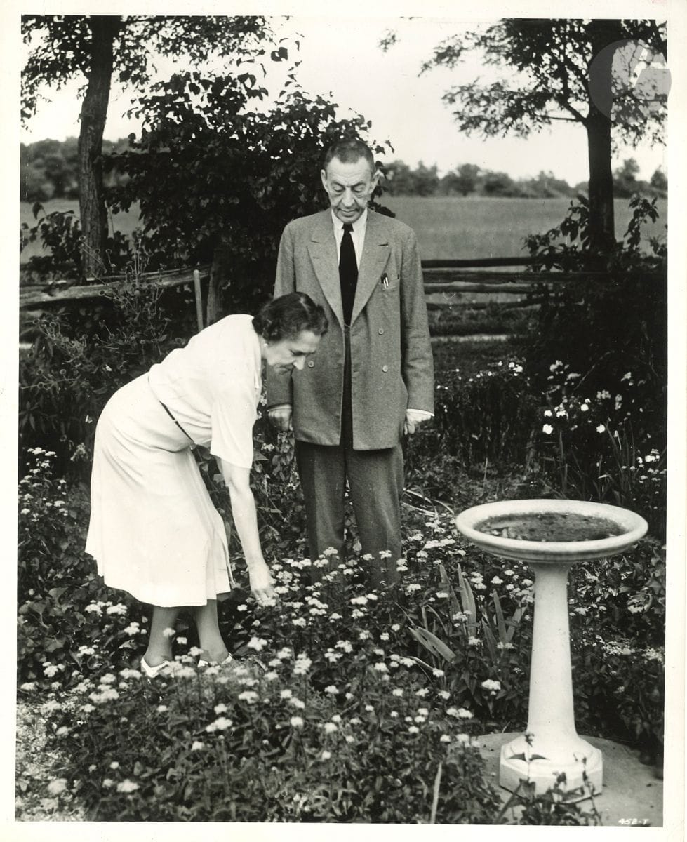 [Sergei RACHMANINOV (1873-1943)]. Original photograph; silver print (25.5 x 20.5 cm). Rachmaninov with his wife, in their flower garden. Enclosed is an engraved portrait of Franz Schubert (by Henry Chapront, artist's proof); and a photograph of Pablo de Sarasate.