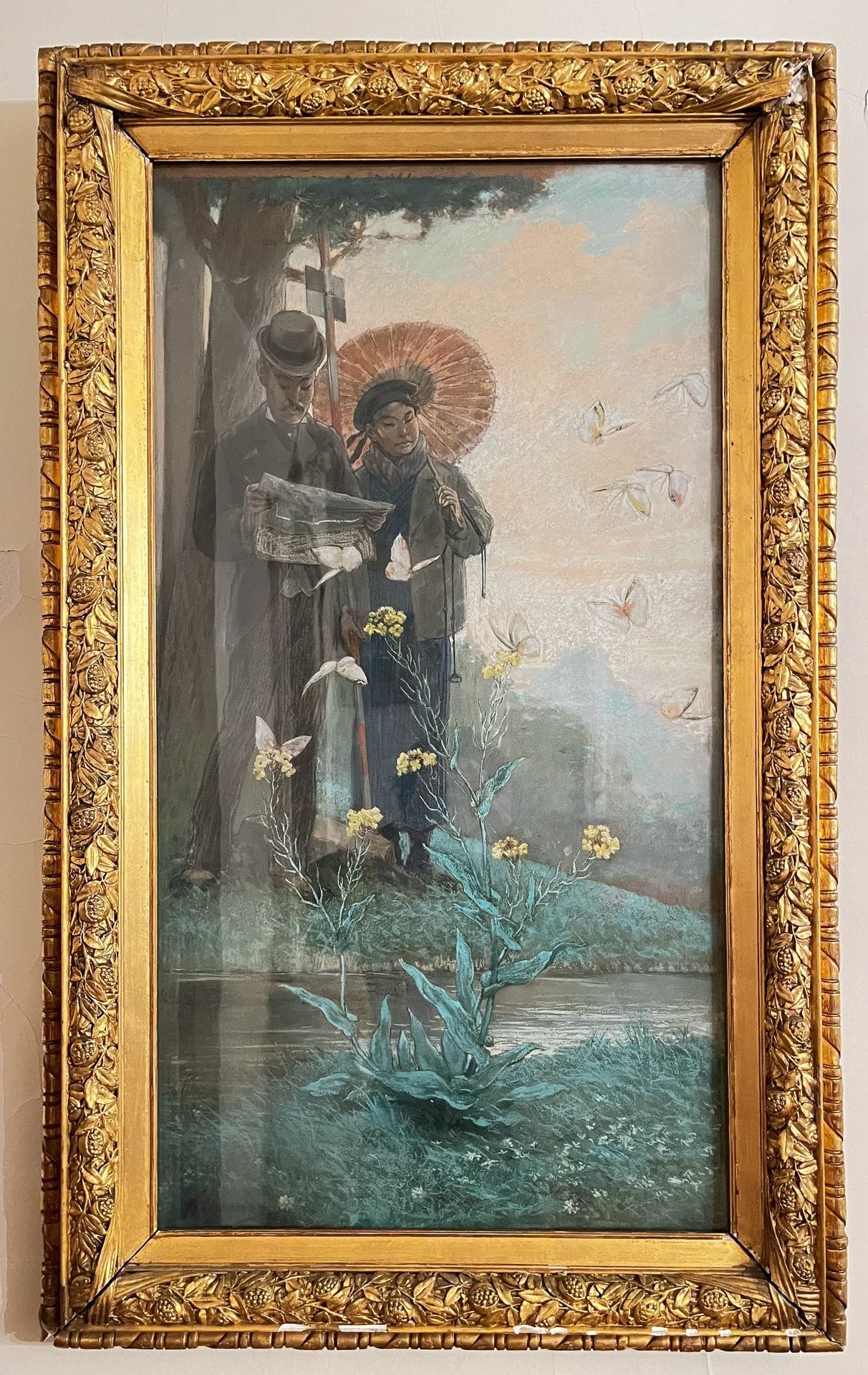 Félix REGAMEY (1844-1907)
"Young Japanese engineers expropriate butterflies for public utility", ca. 1880
Pastel on paper mounted on canvas, framed under glass, depicting two Japanese men in the middle of nature, one dressed in European garb, wearing a hat and looking at a document, the other a little further back in more traditional garb but with the beginnings of a Western influence, holding an open parasol in his left hand and a photogrammetric target in his right. Around them, a swarm of butterflies flutter by a stream and a flowering aquatic plant, in an unspoiled natural setting.
Signed lower left. 
105 x 56 cm (view)
Large transverse tear and holes.

This pastel, probably produced in the early 1880s, was clearly inspired by a drawing by Félix Régamey published in "Japon en images" and entitled "Fantaisie. -- Young Japanese engineers expropriate butterflies for public utility". There are some variations between the two works, whether in the costumes or the background décor, but the message remains the same. The artist exhibited in 1882 at "L'Exposition des Beaux-Arts, Salon de 1882" in the "Arts Décoratifs" section, whose catalog refers to this work. If certain details of the drawing do not appear in the pastel, such as the highly industrial background, it's because the sketch from life becomes a decorative painting presented in a salon. But there remains the enigma of one of the protagonists carrying a surveyor's tool. Here's the explanation. 

In the twilight of the 19th century, as Japan was opening up to the West, the French artist Félix Régamey, like an amazed witness, ventured into this land of the Rising Sun. Among his souvenirs, an enigmatic sketch catches the eye: "Young Japanese engineers expropriate butterflies for public utility". In this particular scene, Régamey has captured the emerging duality. The young Japanese, heirs to a long tradition, face the pressure of progress. The expropriation of butterflies, ephemeral symbols of nature, symbolizes the inexorable encroachment of modernity on the past. It's a delicate dance between the old and the new, in which butterflies become silent witnesses to social change. 

In this way, Régamey's sketch, and by extension his pastel, go beyond mere representation to become a timeless metaphor. The butterflies, torn from their graceful flight, are messengers of a nation in transition, where the quest for public utility is measured against preserved traditions. Even today, in the bustling streets of Tokyo or the quiet corners of Kyoto, this duality persists, sculpting modern Japan while paying homage to the fleeting shadow of expropriated butterflies.