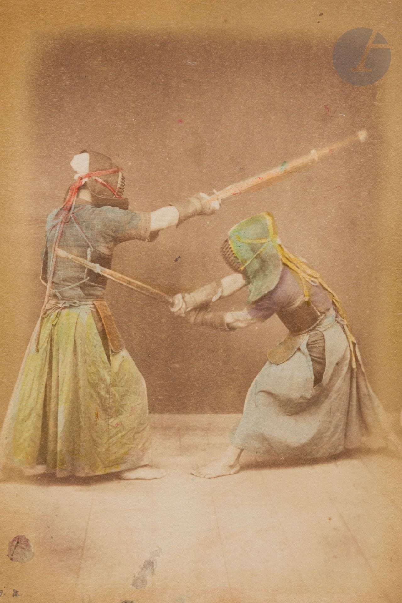 Unidentified photographer 
Japan, c. 1880-1890. 
Tea picking. Dancers. Samurai. Fights. Musicians. Tea ceremony. Smoked fish stall. Masseur. Weaving loom. Cabinetmaker. Basket-making. Theater. 
Oblong in-8 album bound in leporello with lacquered boards, composed of 50 albumen prints, enhanced with watercolors and mounted on cardboard. Some captions in headbands in the negatives. 
Average size of prints: 13.5 x 9 cm