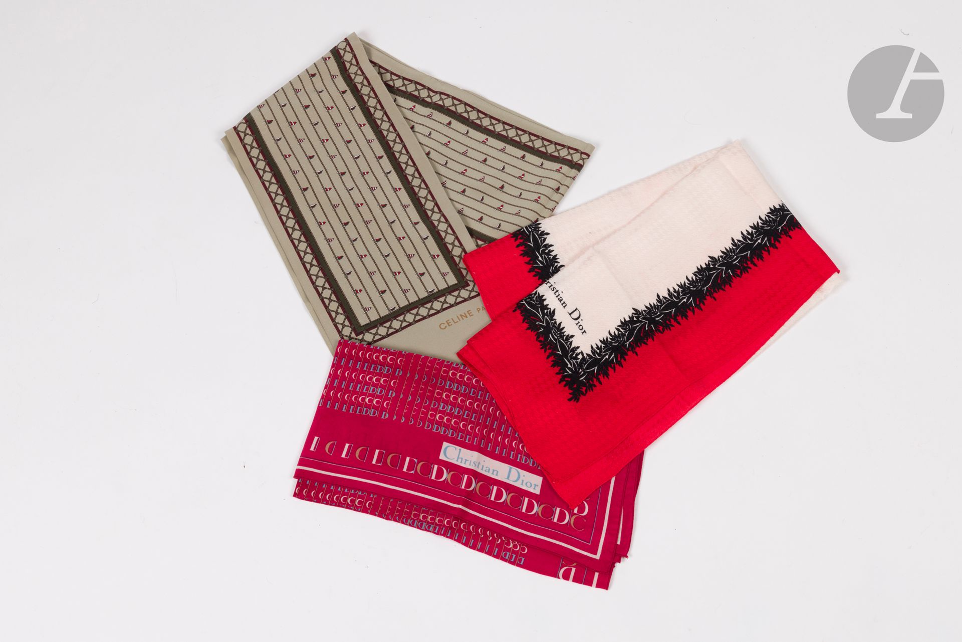 Three silk pieces: 2 Christian DIOR scarves, 65 x 65 cm and 54 x 58 cm, and 1 CELINE scarf, grey-beige background, 140 x 16 cm