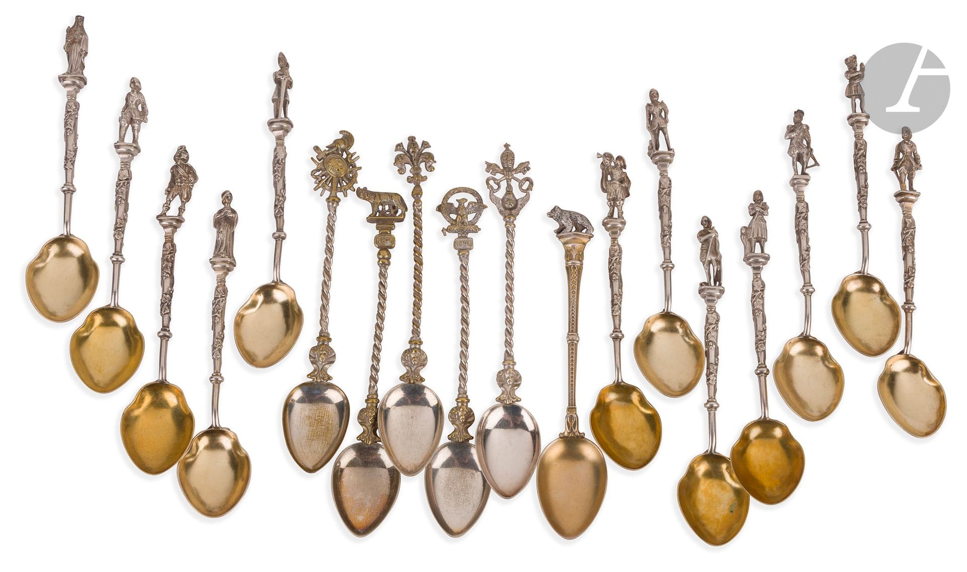 # FRANCE 19th CENTURY
Twelve small silver spoons, the vermeiled spoonhead with historical figures.
Stamped with wild boar
Goldsmith : Jules GALLERAND
Weight : 232 g - length : 12.3 cm
Five small metal spoons probably of Italian origin and a sixth silver spoon topped with a bear (second title), weighing 13 g.