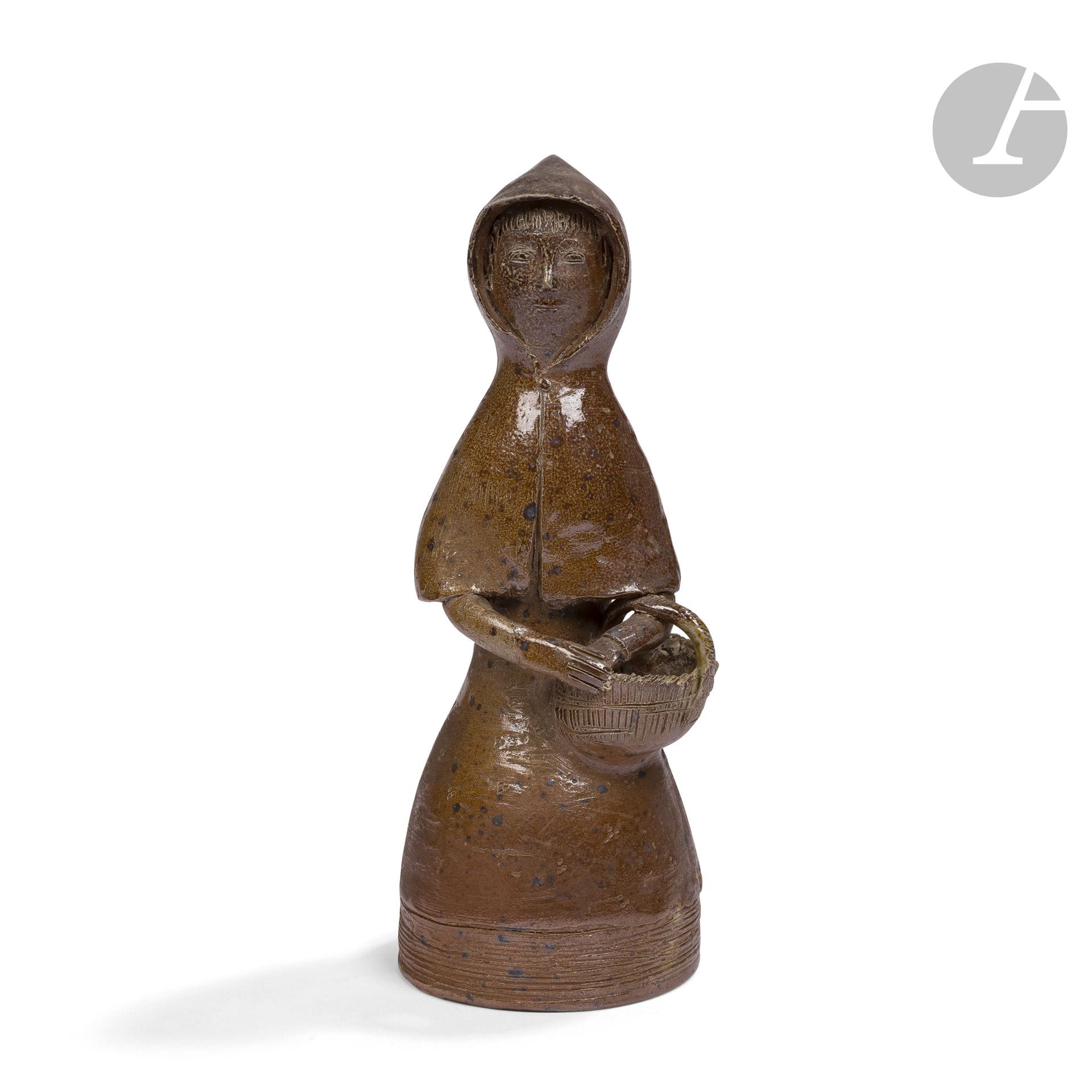 JEAN AND JACQUELINE LERAT (1913-1992) (1920-2009)
Woman with hood and basket
Sculpture.
Proof in pyrite stoneware; fired in the Rue Vauvert kiln in Bourges.
Late 1950s.
Signed J. LERAT towards the base. 
Height: 29.5cm

Important notice:
This work will be included in the catalog raisonné of the work of Jean and Jacqueline Lerat currently in preparation.