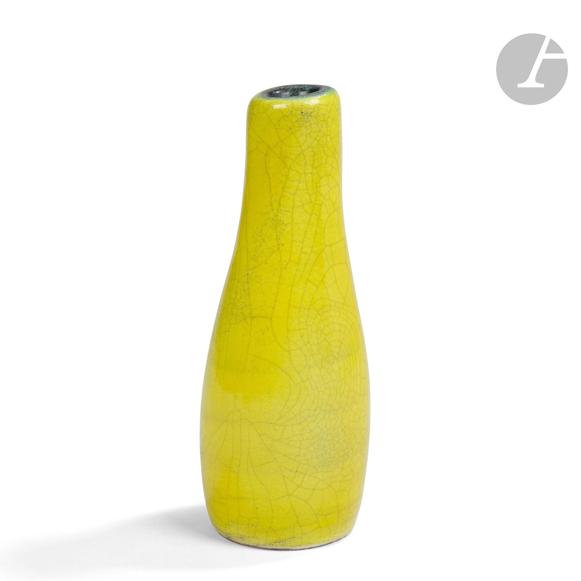 GEORGES JOUVE (1910-1964)
Variante de la série Galet, vers 1957
Rare vase soliflore piriforme au col décentré.
Épreuve en céramique émaillée jaune et à large résille.
L’intérieur émaillé noir.
Signé JOUVE et du monogramme A. P. (aux lettres entrelacées) pour Apollon, marque dite à l’Alpha, et porte le lettre E, en incisions au revers.
Hauteur:25cm

Bibliographie et œuvres en rapport:
- Michel Faré – Jouve céramiste – Éditions Art et Industrie, Paris, 1965. Des œuvres à rapprocher reproduites page 89.
- Préface de Pierre Bergé, textes de Philippe Jousse et de Norbert Pierlot - Georges Jouve - Éditions Jousse Entreprise, Paris, 2005. Des œuvres à rapprocher reproduites pages148, 287 et 289.