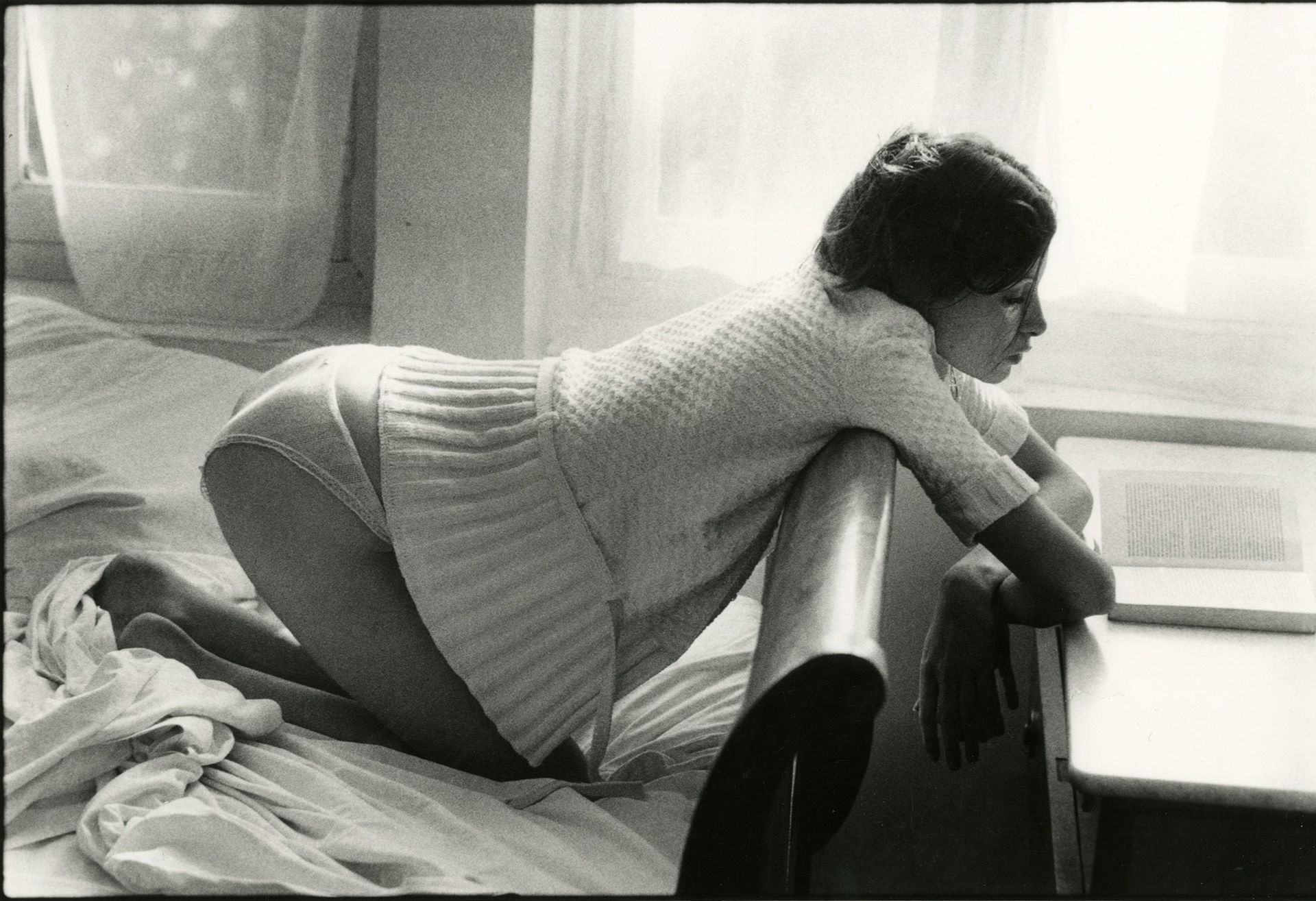 Jean-François Jonvelle (1943-2002)
Young woman with book, c. 1980. 
Silver print (c. 2010). Copyright by Jean-François Jonvelle" stamp in lower right margin. 
Image : 22,8 x 34,3 cm / Sheet : 30,2 x 40,3 cm
