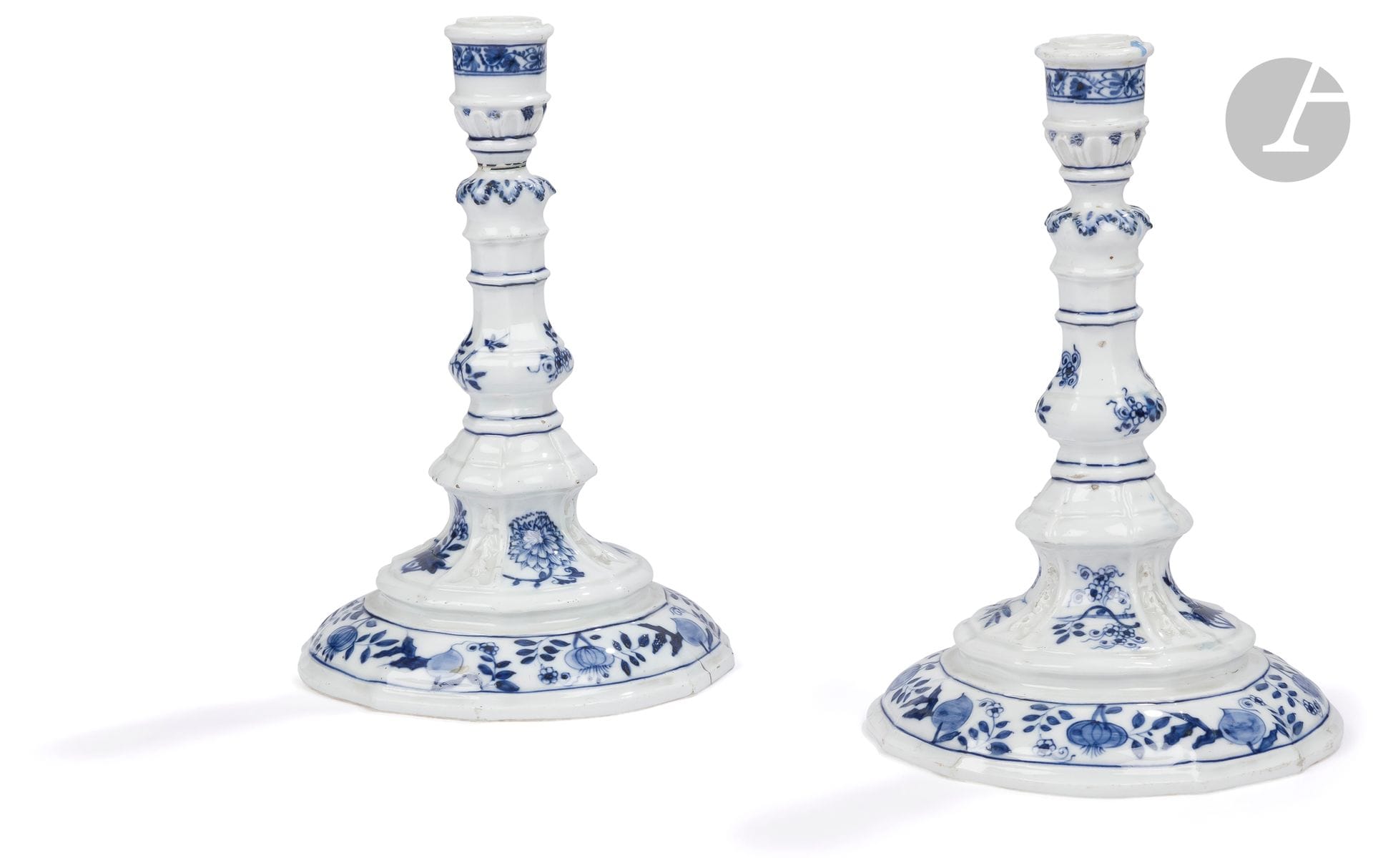 Meissen Pair of porcelain torches with blue monochrome decoration of flowers and foliage. Marked : crossed swords and star in blue. 
Late 18th century. 
H. 24 cm 
One broken and glued.