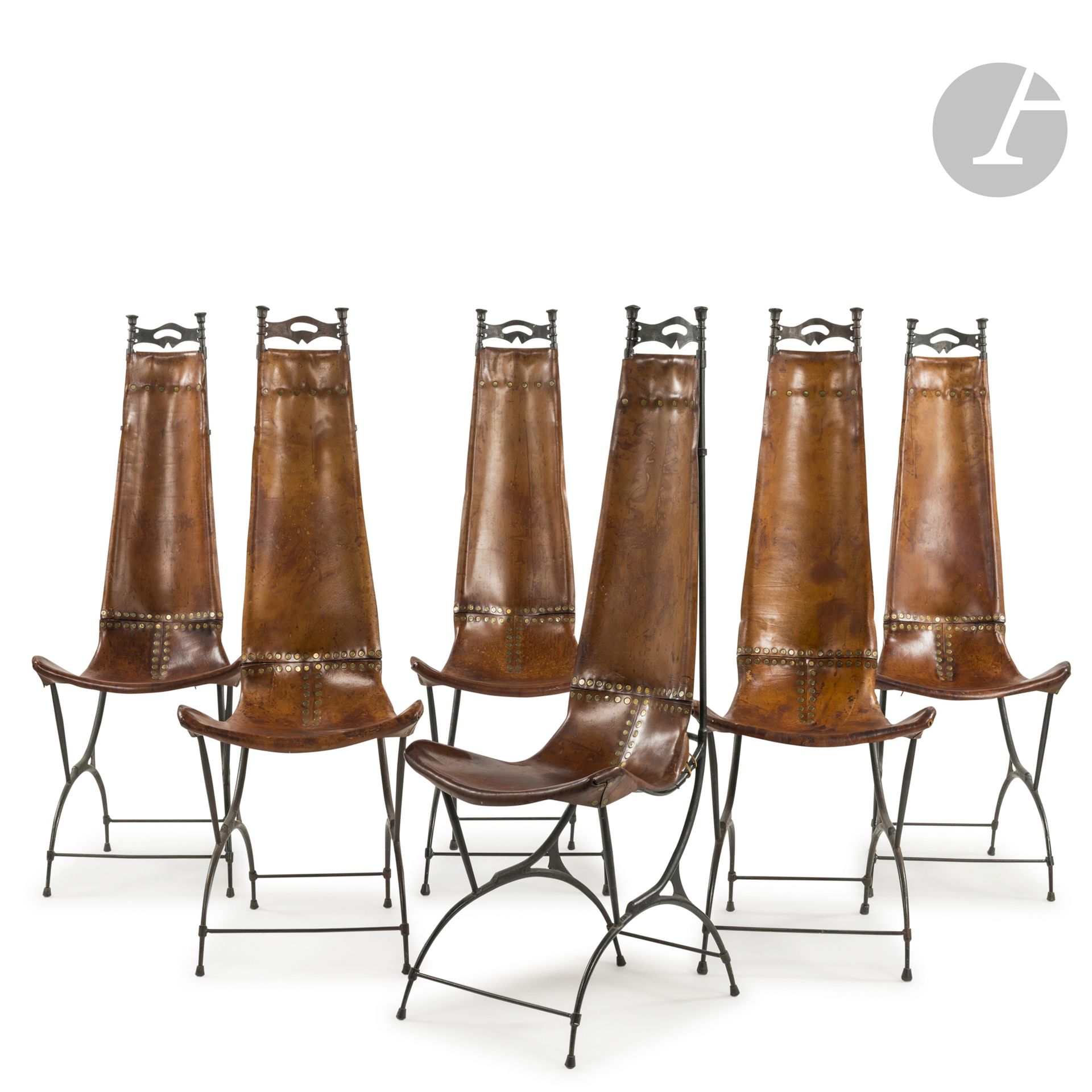 SIDO (1934-1986) (GISÈLE SIDOTI, DITE) &amp; FRANÇOIS THEVENIN (1931-2016)
Untitled
6 high-back chairs. Wrought-iron structures, assembled by stapling and welding; four with black patina, two with brown patina. The seats, extending into backrests, are made of stretched and riveted leather. Used condition, stains and scratches on the leather parts. Two chairs signed with the S. F. T. monogram stamp (crossed letters) on the back at the bottom of the leather back. H.124cm - W.46cm - D.46cm