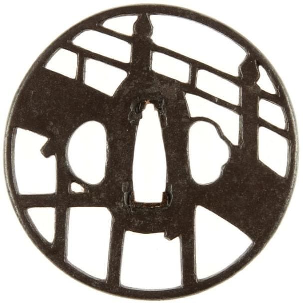 JAPON
Maru gata en fer à décor ajouré en yo sukashi d'un pont.H. 7,7 cm
