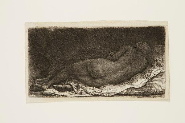 Rembrandt Harmensz. van Rijn (1606-1669)
Négresse couchée. 1658. Eau-forte, pointe sèche et burin. 160 x 83. Bartsch, White-Boon (Hollstein) 205. Superbe épreuve sur vergé mince, richement encrée, du 3e état (sur 5 selon Nowell-Usticke) avec reprises prononcées sur les contours de la figure et nombreuses tailles additionnelles. Petites épidermures au verso. Marges étroites. Tirage Basan