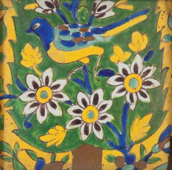 Deux carreaux à décor dit de lignes noires, Iran, XVIIe-XVIIIe siècle Le premier, partie de composition sur fond bleu bordée d'une frise foliée de lotus sur fond jaune; le second, partie de composition sur fond jaune au cyprès fleuri et habité d'un oiseau. Dim. chaque: 22,6 x 22,6 cm (Une fêlure sur un carreau)