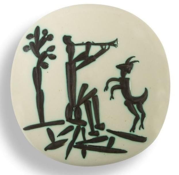 Pablo PICASSO (1881-1973) & MADOURA
Joueur de Flûte et chèvre, modèle créé en 1956. Plaque murale convexe, dite ronde carrée. Édition originale limitée à deux cents exemplaires réalisés chez Madoura. Épreuve en terre de faïence blanche, gravure soulignée de paraffine oxydée, bain de couverte, ivoire, brun. Marquée des cachets Empreinte Originale de PICASSO et MADOURA Plein Feu au revers. 25,5 x 25,5 cm. Bibliographie:. «Picasso, catalogue de l?oeuvre céramique édité 1947-1971» par Alain Ramié. Editions Madoura, 1988. Modèle identique reproduit page 198 sous le numéro 211 du catalogue (référence Bloch B.76)