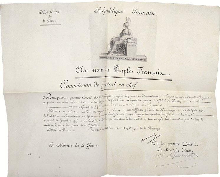 Napoléon ier. P.S. « Bonaparte », Paris [11] fructidor XI (29 août 1803) ; contresignée par le secrétaire d’État Hugues Maret ; vélin in-plano en partie impr., en-tête Commission de Général en chef, grande vignette gravée par Barthélemy Roger au nom de Bonaparte Ier Consul de la République (BB n° 232), sceau sous papier.Commission de général en chef pour le général Davout. « Bonaparte, premier Consul de la République, ayant à pourvoir au Commandement des Troupes réunies au Camp de Bruges et prenant une entière confiance dans la valeur, l’expérience et la fidélité dont a donné des preuves le Général de Division Davoust le nomme Général en chef Commandant les Troupes du Camp de Bruges »…