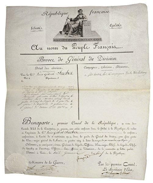 [Louis-Gabriel SUCHET]. 85 L.S. ou P.S. à lui adressées, 1796-1823, plus qqs minutes autographes de réponse ; 95 pages formats divers, dont 10 sur vélin, nombreux en-têtes et vignettes, qqs cachets cire rouge ou encre, qqs sceaux sous papier, qqs adresses, classés sous 32 chemises titrées.Important ensemble des brevets, titres, décorations et lettres de service du maréchal Suchet, tout au long de sa carrière. 1er nivose V (21 décembre 1796), promotion au grade de chef de bataillon : L.S. par le général Alexandre Berthier. 7 brumaire VI (29 octobre 1797), brevet de chef de brigade d’infanterie, signé par le Directeur Merlin de Douai et le ministre de la Guerre Scherer. 3 germinal VI (23 mars 1798), nomination au grade de général de brigade « près les Troupes qui sont dirigées vers les côtes de la mer Méditerrannée » : 2 L.S. par Scherer ; 9 germinal, ordre de rejoindre l’Armée d’Helvétie signé par le général Ernouf ; 13 germinal-28 prairial (2 avril-16 juin), 4 L.S. par Scherer confirmant le grade et l’envoyant à l’Armée d’Italie. 12 frimaire VII (2 décembre), affectation à l’armée d’Helvétie, 7 nivose (27 décembre), cessation de toutes fonctions, 6 ventose (24 février 1799), affectation à l’Armée de Mayence : 4 L.S. ou P.S. par Scherer. 22 messidor (10 juillet), promotion au grade de général de division, et nomination de chef de l’État-major général de l’Armée d’Italie : 3 L.S. par Jean Bernadotte, ministre de la Guerre ; plus 2 brevets de général de division délivrés en 1800 et 1801, signés « Bonaparte » (secrétaire) et par Hugues Maret, et les ministres de la Guerre Lazare Carnot (1er) et Alexandre Berthier (2e). 1801-1803, 3 lettres de service d’inspection générale d’infanterie, signée par Alexandre Berthier. 4 brumaire XII (25 octobre 1803), 4 lettres de service de général commandant la 4e Division de l’armée formant le camp de Saint-Omer, signées par Alexandre Berthier. 20 frimaire (11 décembre), nomination de membre de la Légion d’honneur, et 26 prairial (14 j