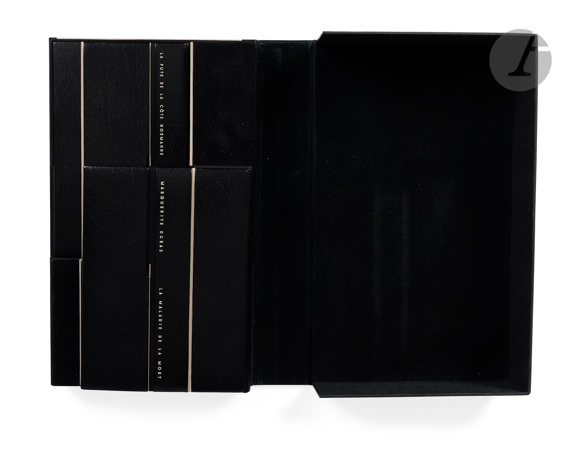 DURAS (Marguerite). 
La Maladie de la mort. - La Pute de la côte normande.
Paris: Les Éditions de Minuit, [1982-1986]. -2 works in 2 in-12 volumes, 188 x 140 and 184 x 115: 60 pp. (2 ff.), printed cover; 19 pp. (2 ff. first blank), printed cover. Black oasis, boards with two vertical grooves, one decorated with a small white calf listel, the other entirely inlaid with white calf, author's name and title in white letters on the first boards, smooth spines, white suede lining and endpapers, untrimmed, covers and spines preserved, special slipcase with black morocco spine and small bands, including inside a compartment for each book, bordered by a white calf listel coming continuously from those on the volumes (N. Berjon 2007).

First edition of these 2 works by Marguerite Duras.

One of 106 copies on Arches vellum for the first title (no. 10) and one of 106 on Lana chiffon vellum for the second (no. 70), the only large paper editions.

Copies remarkably bound by Nathalie Berjon in 2006, preserved in a special compartmented slipcase.