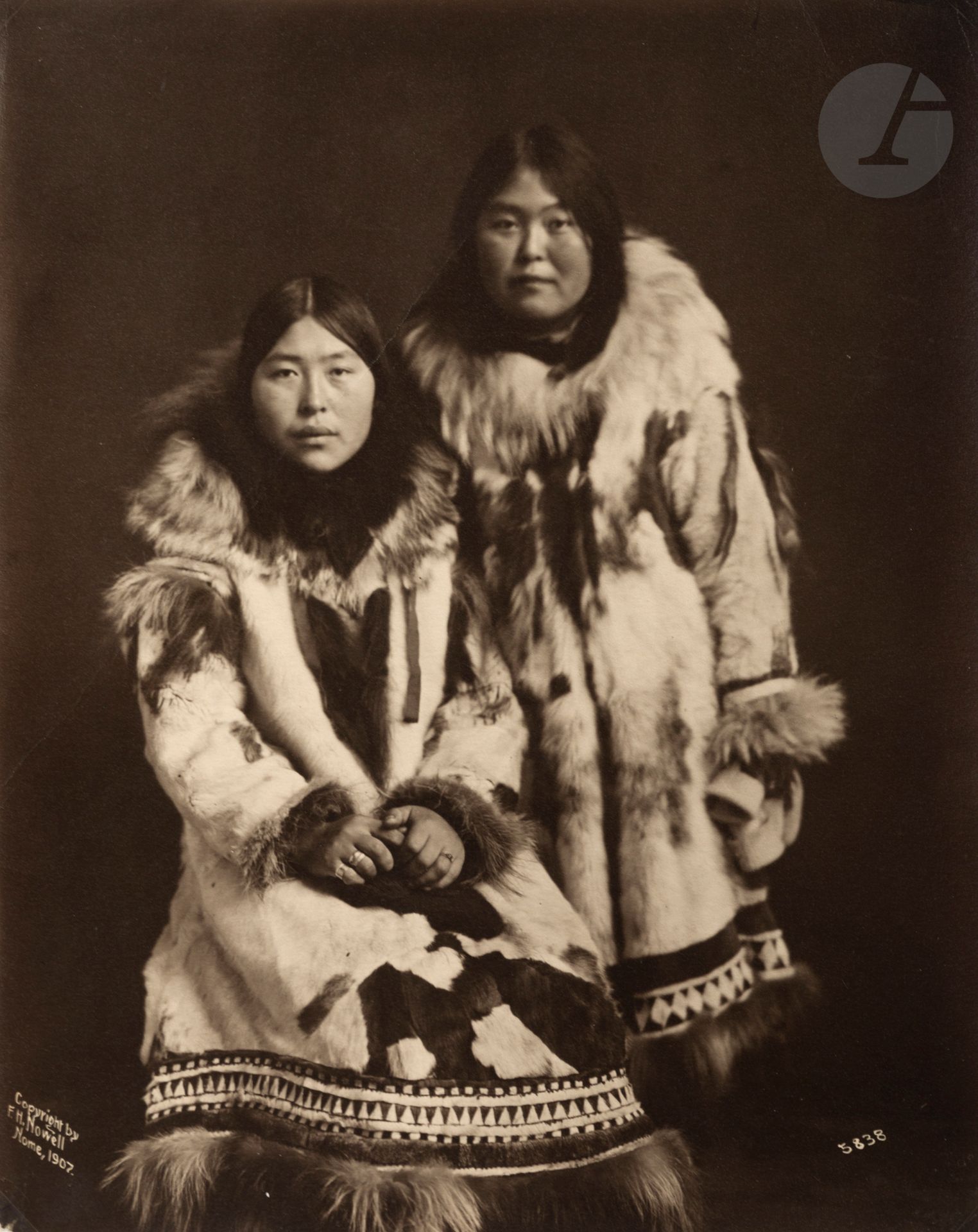 F. H. Nowell 
Two Inuit women. Nome [Alaska], 1907. 
Vintage silver print. Photographer's copyright, location, date and reference number in negative at bottom. Folding. 
24.5x19.5 cm