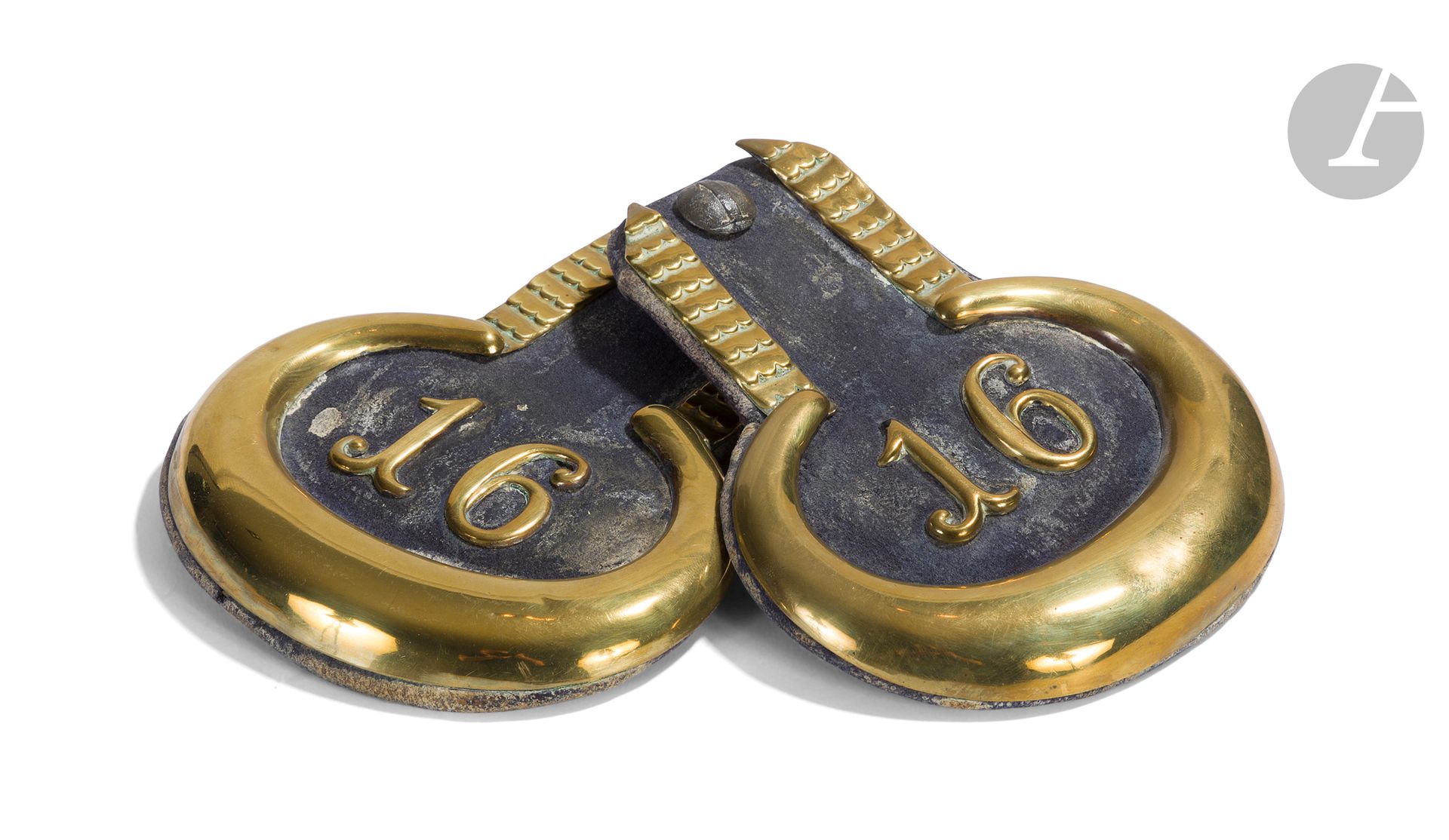 Pair of German officer's epaulets.
Leather with brass border and "16" number. Buttons with numbers "1" and "2".
A.B.E. 
Length: 16 cm