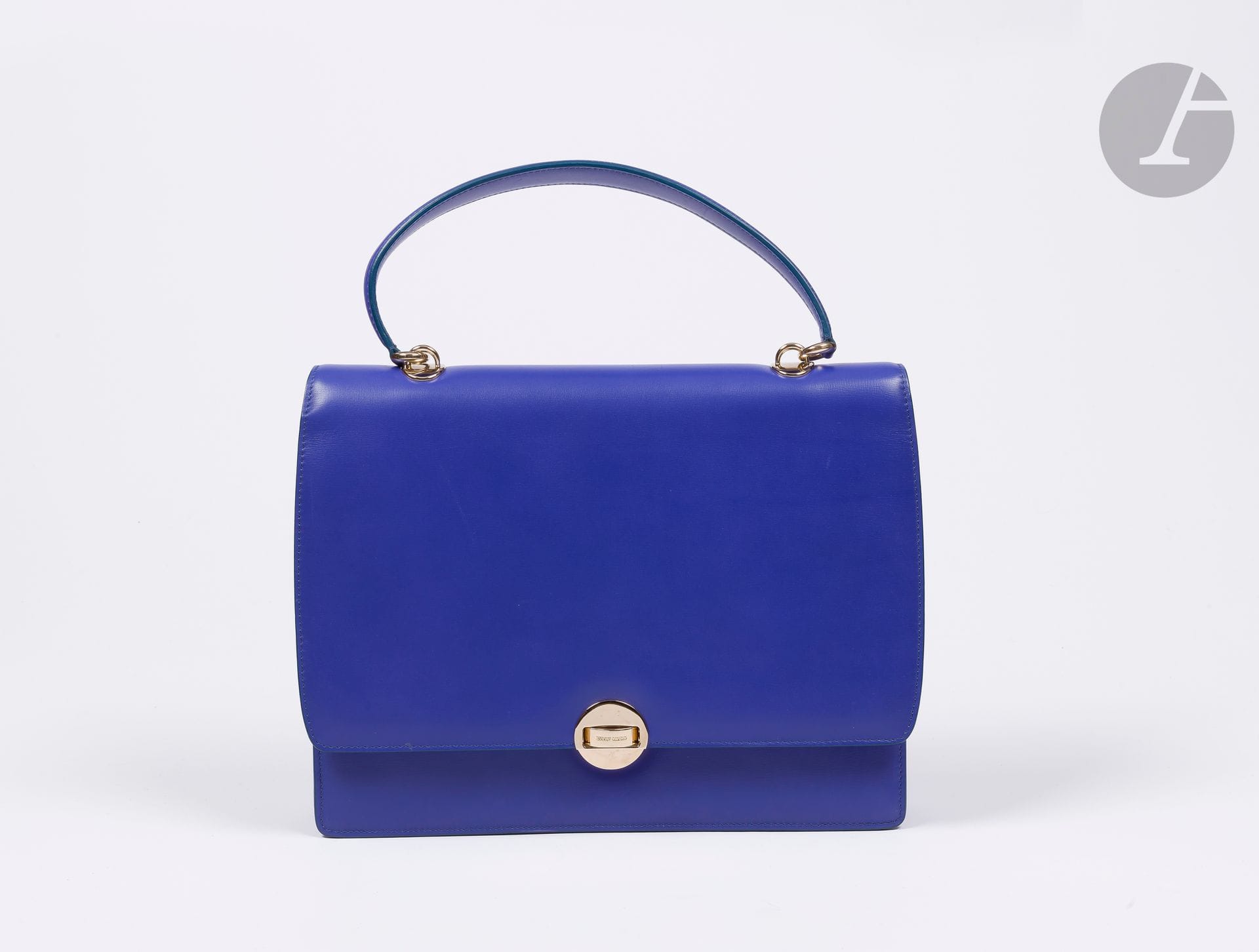 °Giorgio ARMANI
Sac façon cartable en cuir indigo, bordures bleues, garniture en métal doré, dustbag 32 x 26 x 6 cm