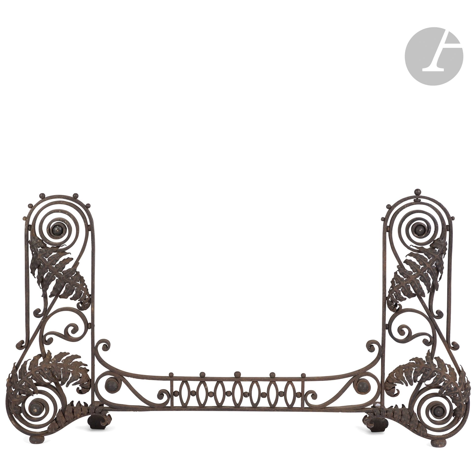 ART NOUVEAU WORK
Les Fougères
Wrought-iron bar with patina finish. Lateral parts in double scrolls with title motifs treated in cut, worked and patinated sheet metal; central bar with geometric decoration. Complete with rear jambs. Circa 1900. Oxidation marks. H.58cm - L.105cm

This lot can be collected from our furniture repository, SG GAURIAT, 31 boulevard Anatole France, SAINT-DENIS (93200), by appointment (24 h in advance), Monday to Friday, 9am to 1pm and 2pm to 4pm (contact@gauriat.com - +33 (0)1 71 70 29 50). Purchases will be stored free of charge until June 27, after which a fee of 60 euros (excl. VAT) will be charged per item of furniture per week, plus 20 euros (excl. VAT) for administrative procedures.