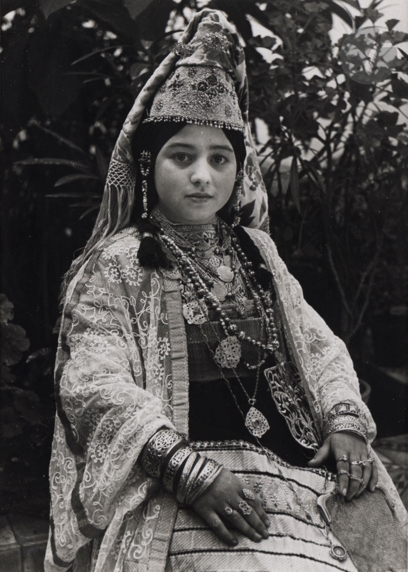 Jean Besancenot (1902-1992) 
Morocco, 1934-1939. 
Young Jewish Woman from Salé Wearing the Kesua el Kbira. 
Silver print (c. 1980), matted, signed in pencil on the mount lower right. Handwritten caption and negative number in pencil inside lower mount. 
23.8 x 17.7 cm