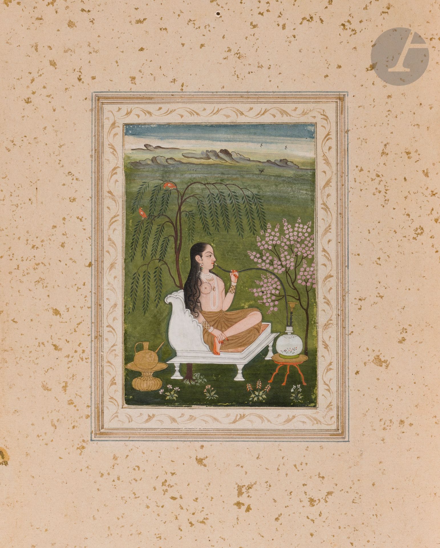 Woman smoking huqqa, India, Deccan, late 18th - early 19th century
Gouache and gold on paper depicting a woman seated three-quarters on a white throne, smoking a huqqa placed on a pedestal table in front of her. Her torso is bare and she is richly adorned with jewelry. Beside her seat are a ewer and a basin. The scene takes place in a landscape, under a tree animated by birds, others in flight in the background. Mounted on an album page with a gilded scroll border and gold-flecked margin. On the reverse, a Persian quatrain nast'aliq obliquely inscribed in black ink on a gold-painted background of floral scrolls animated by a feline and a simurgh. Two blue and salmon borders and the same margin speckled with gold frame the whole.
Page size: 32.8 x 26.2 cm; painting size: 16.2 x 10.8 cm; calligraphy size: 12.6 x 5.6 cm
Some wear to the polychromy, stains, small folds and slight accidents to the calligraphy.

Provenance : 
Ader Picard Tajan sale, Paris, May 11, 1982, lot 39.