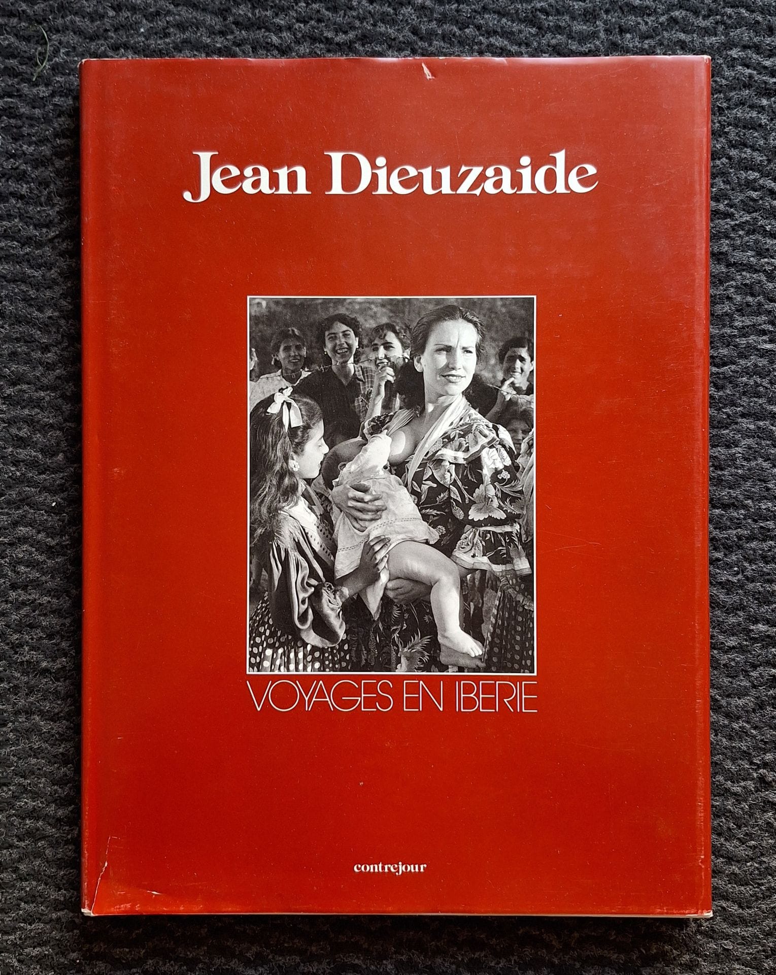 DIEUZAIDE, JEAN (1921-2003) [Signed]
Voyages en Ibérie.
Contrejour, 1983.
In-4 (30 x 23 cm). Édition originale, dédicacée et signée par Jean Dieuzaide en page de titre. Texte de Gilles Mora. 128 pp. Cartonnage blanc titré en noir, sous jaquette illustrée (une petite déchirure).