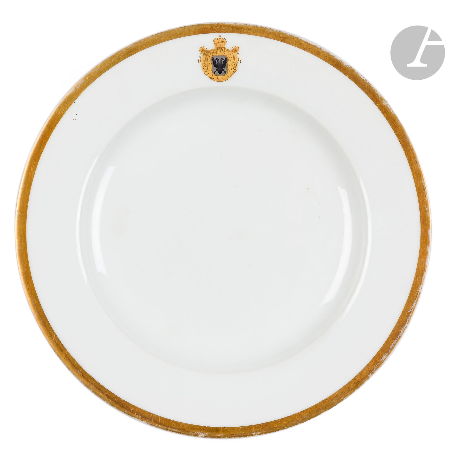 Round porcelain plate, Baranowka factory, 1804-1825
Decorated on the rim with a double-headed eagle, the rim gilded. Baranowka mark with three stars and n°9 under the base. 
Diameter: 24.5 cm
Chips.

[POLONICA, POLISH ART]