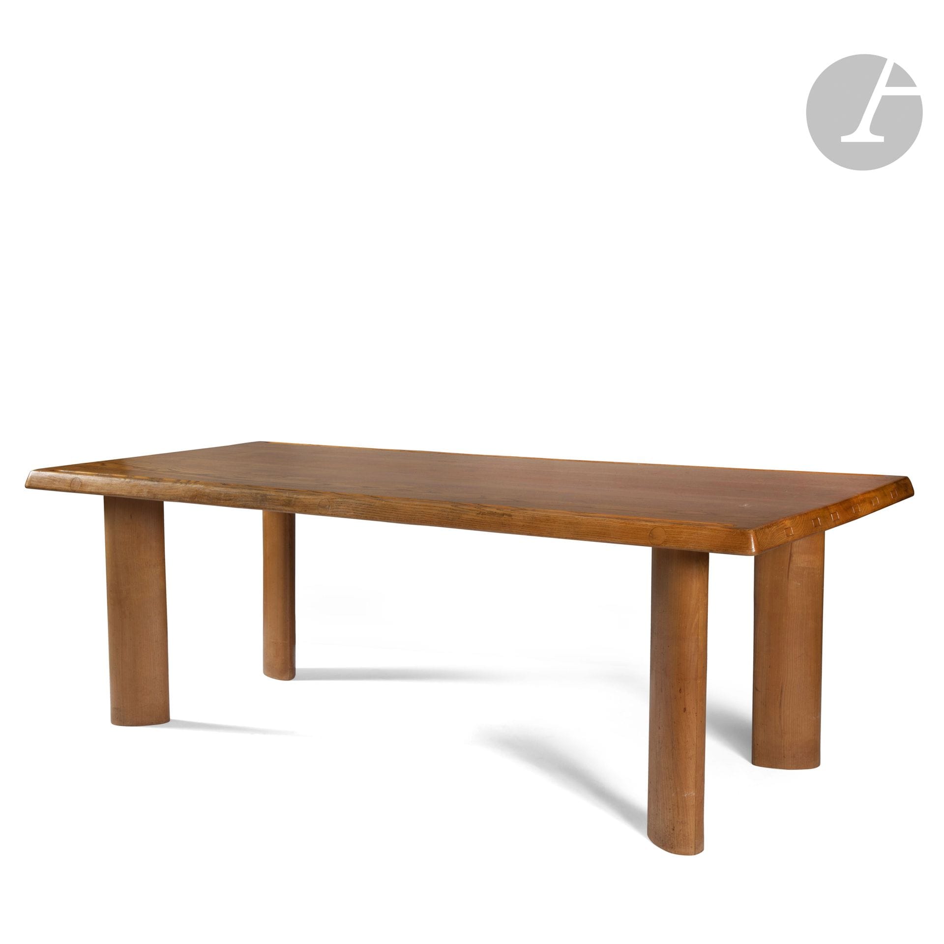 CHARLOTTE PERRIAND (1903-1999) - SUCCESSION X., MANTES-LA-VILLE
Table à gorges, modèle conçu vers [1954], œuvre acquise à la Galerie Steph Simon vers 1960
Table de salle à manger en frêne.
L’épais plateau au pourtour légèrement chanfreiné et assemblé par languettes. 
Son assemblage assuré par des tiges filetées ; masquées sur la tranche par des pastilles circulaires également en frêne.
Le dessus présentant deux longues gorges creusées sur chaque bord des parties longitudinales.
Les quatre pieds en léger retrait des angles et de forme elliptique.
État d’usage.
Hauteur : 70 cm – Longueur : 199 cm – Profondeur : 86 cm

Provenance :
Succession X., Mantes-la-Ville. Œuvre acquise auprès de la Galerie Steph Simon vers 1960. Cette table faisait partie d’un aménagement complet conçu par le décorateurColas Guérin pour M. et Mme X., comprenant un ensemble mobilier de Charlotte Perriand (banquette Tokyo, deux tabourets Berger, notre table et suite de chaises) complété d’une applique de Serge Mouille et d’un meuble d’André Chetaille présentés sous les numéros suivants de cette vacation.

Bibliographie :
- Aujourd’hui Art et Architecture – N° 7 de mars 1956. Variante de longueur reproduite page 80.
- Aujourd’hui : art et architecture– N° 7 de mars 1956. Variante de longueur reproduite page 80.
- Charlotte Perriand, l’œuvre complète, 1956-1968, Vol. 3 - Jacques Barsac, Éditions Norma, Paris, 2017. Variantes de longueur et/ou modèles identiques reproduits page 90 et 91 et figurant en dessin sur le prospectus de chez Steph Simon reproduit page 83.
- Charlotte Perriand, Un art d’habiter – Jacques Barsac, Éditions Norma, Paris, 2005. Variantes de longueur et/ou modèles identiques reproduits pages 403, 417 et 436.
- Charlotte Perriand, Un art de vivre - Catalogue de l’exposition organisée au Musée des Arts Décoratifs en 1985, Éditions Flammarion, Paris. Variante de longueur reproduite page 49.
