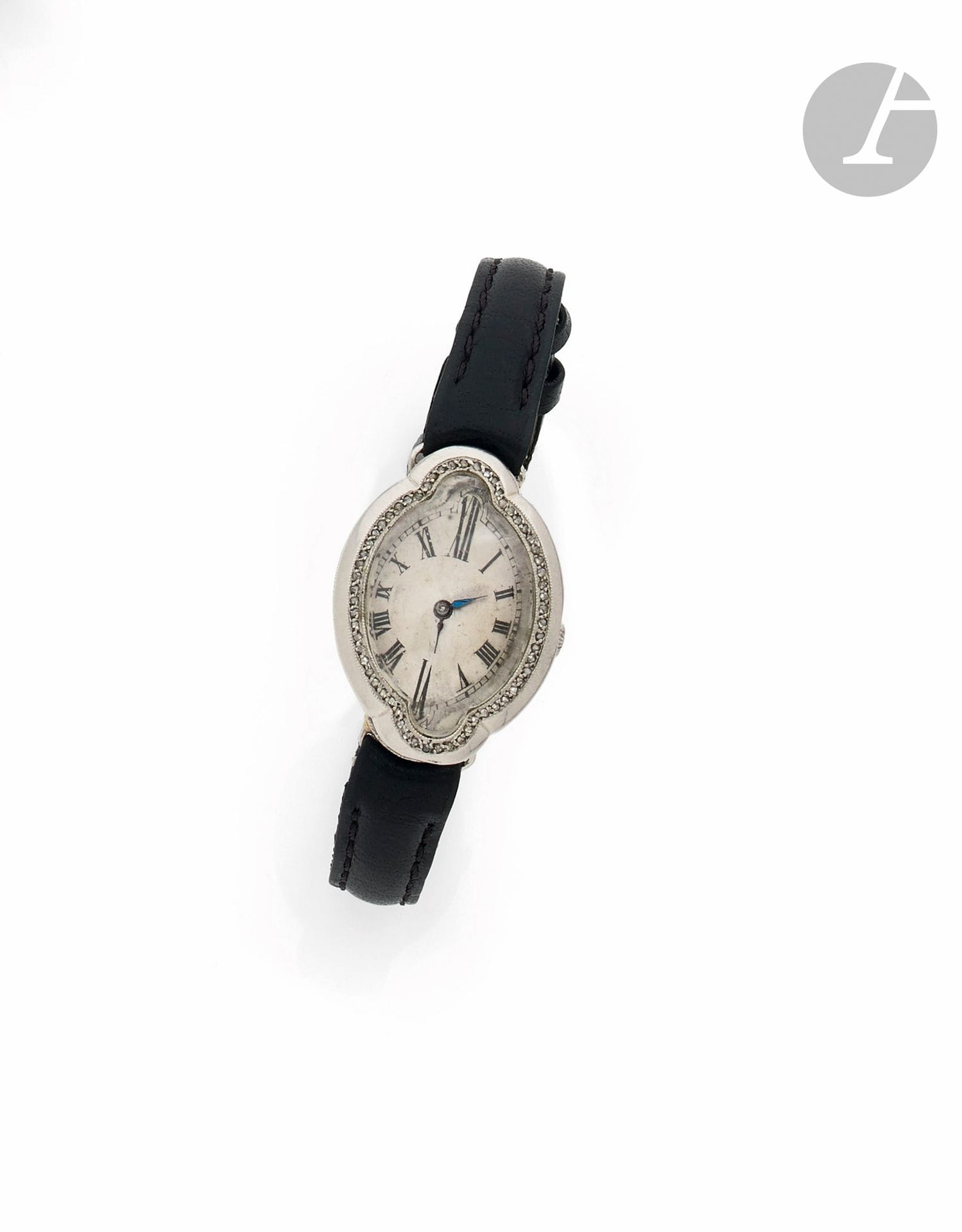 ANONYMOUS
ART DECO
Ladies' wristwatch in 18K (750) white gold and 
diamonds on leather.
Case: oval, hinged with fine lugs, bezel set with small rose-cut diamonds, French work. 
Dial: silvered, painted Roman numeral hour markers, external railway minute track, blued steel hands.
Movement: mechanical.
Strap: leather with attached pin buckle. 
Numbered 5721. 
Size: 31.5 x 22 mm 
Gross weight: 21.7 g 

Provenance: 
Mallié-Arcelin sale, Hôtel Meurice, November 10, 2017, described by M. Xavier Dufestel - Princesse Marie-Louise d' Orléans, 
- By descent: her grandson, Prince Adrian Philippe de Bourbon des Deux-Siciles.