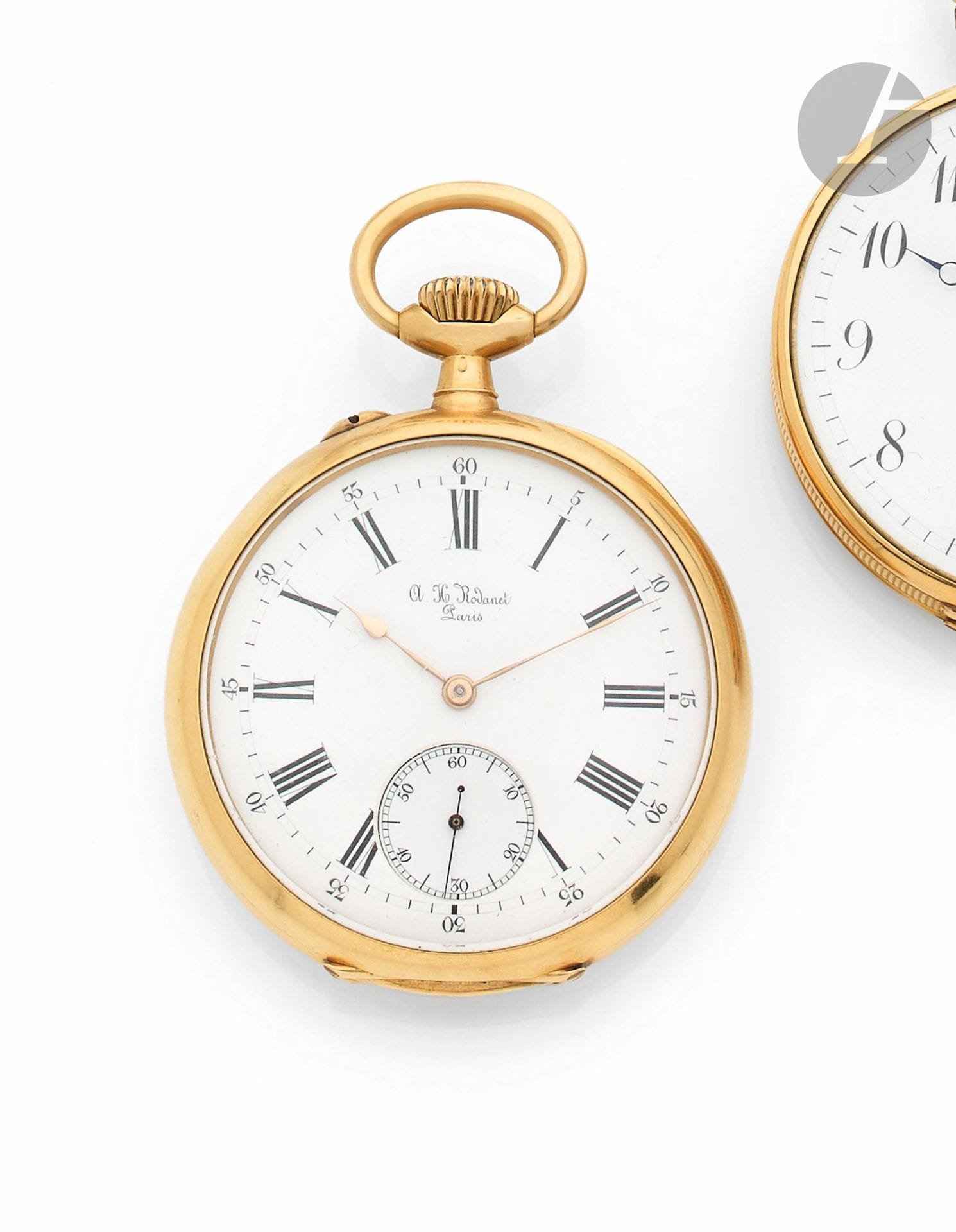A. H. RODANET, PARIS
FIN XIXème
Montre de poche en or jaune 18K (750)
Boîtier : revers monogrammé, cuvette en or gravée : " N° 12829, A. H. Rodanet, constructeur de chronomètres, Paris ". 
Cadran : émail blanc, index chiffres arabes peints et arabes pour les minutes avec minuterie chemin de fer extérieure, petite seconde à 6h, aiguilles 'poire' dorées. 
Mouvement : mécanique en laiton doré, échappement à ancre, balancier bimétallique, Spiral 'Bréguet' en acier bleui. Remontage au pendant. 
Cadran, cuvette et mouvement signés. 
Numérotée 12829. 
Diam. 50 mm 
Poids brut : 92,29 g