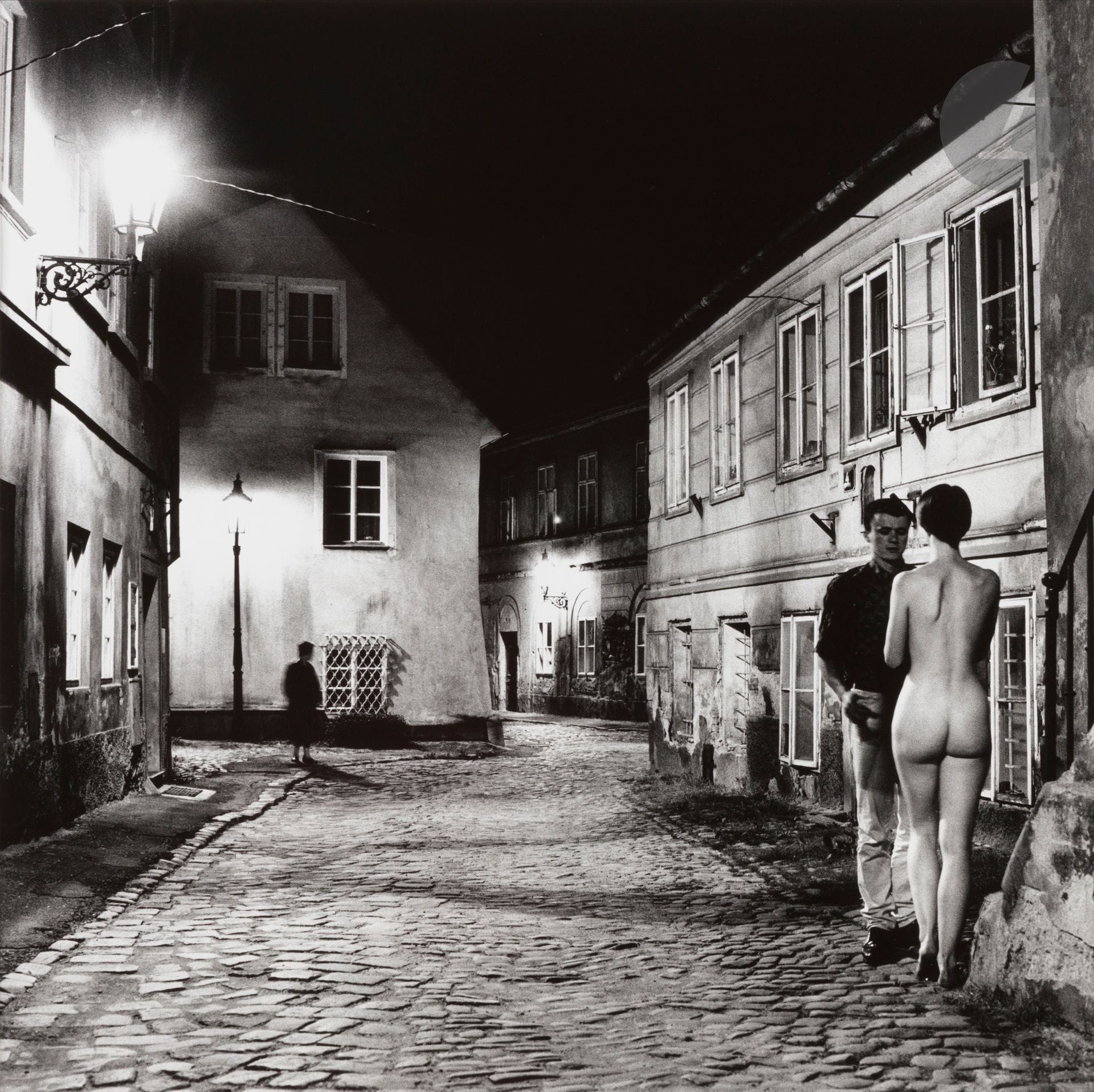 Helmut Newton (1920-2004)
At the New World. Prague, 1988.
Silver print (c. 1990), signed, titled, dated and numbered 10 copies in pencil with "Copyright - Helmut Newton - Monte Carlo" stamped on verso.
Image: 48.5 x 48.5 cm / Sheet: 59.5 x 50.5 cm - frame

Bibliography: 
- Helmut Newton, Helmut Newton's Illustrated n°3, New York, Xavier Moreau Inc. 1987, n.p.
- Helmut Newton, Helmut Newton aus dem Photographischen Werk, Munich, Schirmer Mosel, 1993, pl. 84.

Important French private collection - N°225 to 261
