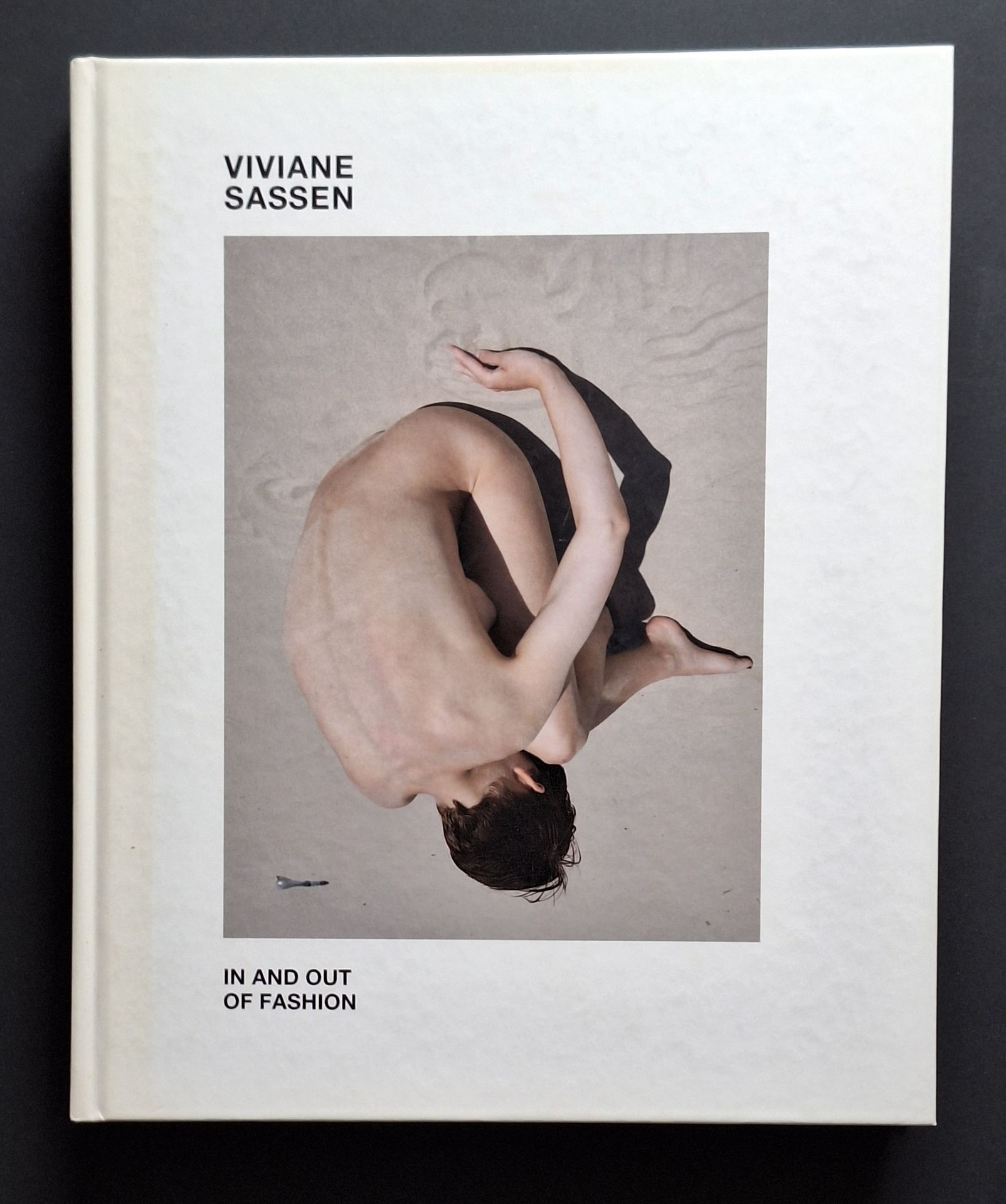 SASSEN, VIVIANE (1972)
In and Out of Fashion.
Prestel, Munich, London, New York, 2013. 
In-4 (28 x 23 cm). First edition. 160 pages of full- and double-page color photographs. Endnotes by Nanda van den Berg and Charlotte Cotton. Illustrated publisher's boards.
