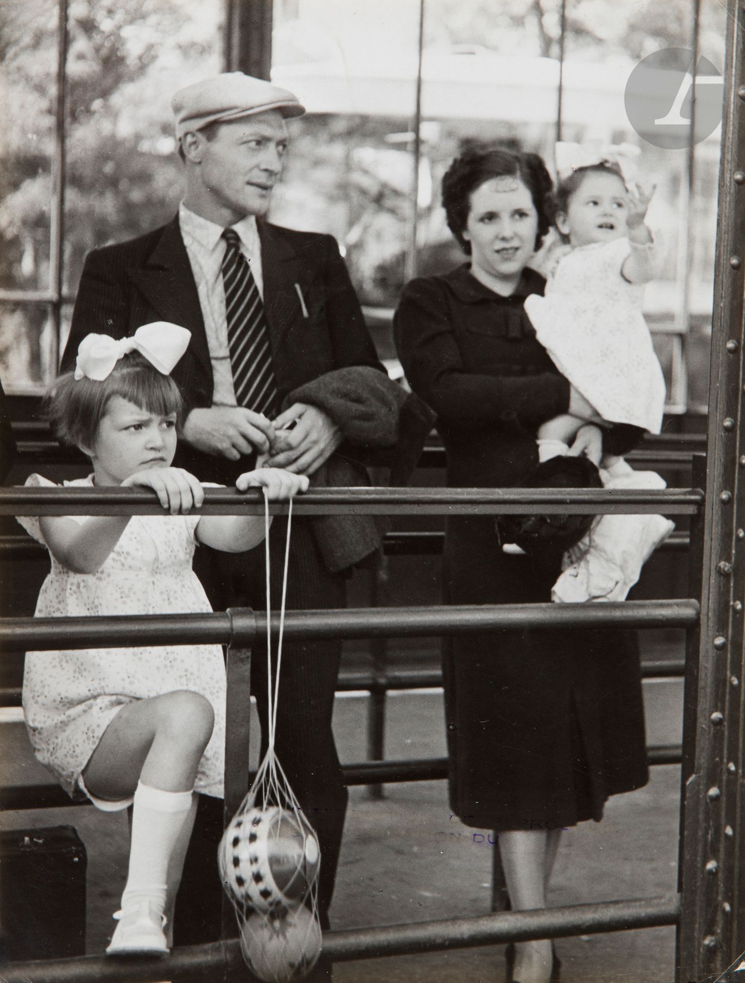 Brassaï (Gyula Halász, known as) (1899-1984)
French Family, c. 1935. 
Period silver print. Stamp "Brassaï - 81, rue du Faub.-St-Jacques - Paris-XIVe - Port-Royal 23-41" and title in ink on verso. 
23.2 x 17.7 cm