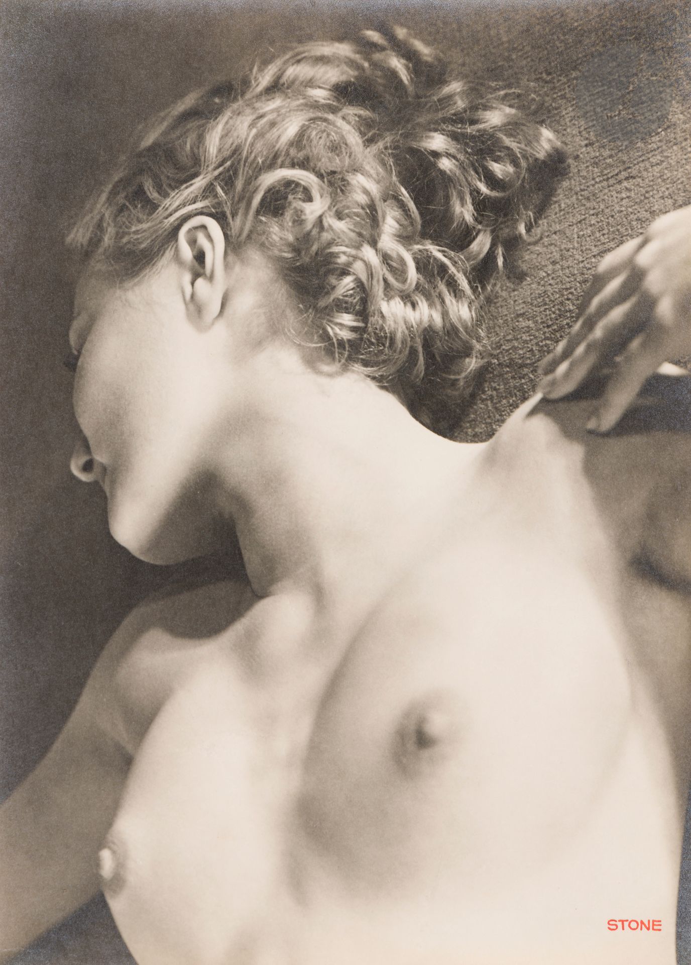 Sasha Stone (1895-1940) 
Nude from the Women series, c. 1932. 
Vintage silver print, signed in red gouache lower right. Stamped "Copyright Stone - Bruxelles" on verso with handwritten reference "38575" in red ink. 
29 x 21 cm 

Bibliography 
- Sasha Stone, Collection d'études photographiques du corps humain. N°1. Femmes. 20 plates by Sasha Stone, Paris, Éditions Arts et Métiers Graphiques, 1933, cover. 
- Eckhardt Köhn, Sasha Stone. Fotografien 1925-1939, Berlin, Dirk Nishen, 1990, p. 90.