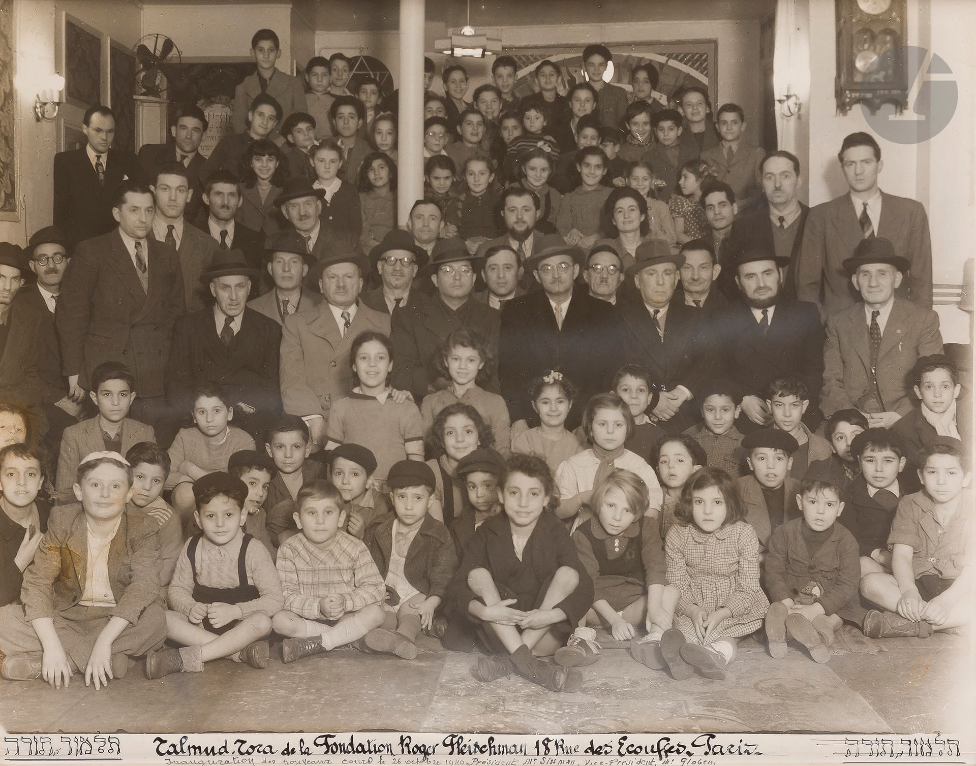 PHOTOGRAPH FONDATION FLEISCHMAN] 
Group photo
Talmud Torah of the Roger Fleischman Foundation 18 rue des Écouffes Paris. Inauguration of the new classes on October 26, 1949.
Vintage silver print. 
37 x 48.5 cm

 The Roger Fleischman oratory on rue des Écouffes, created by Armand Fleischman in memory of his son Roger, was an institution in the Pletzl (the historic Jewish quarter of the Paris Marais) between the wars. Founded in 1931, it was specifically dedicated to the study of Talmud and the education of young children from Eastern Europe whose mother tongue was Yiddish. 







Keywords:
judaica, jew, jewish, hebrew, rabbis, jewish, torah, hebrew, hebraica, judaism, synagogue, zionism, pessah, pessach, haggada, haggadah, hagada, hagadah, passover, menora, menorah, hannuka, hannuca, hannucca, hanouccah, torah, juden, israélite, Israël, antisemitism, antisémitisme, dreyfus, meguila, sepharade, sefarad, ketouba