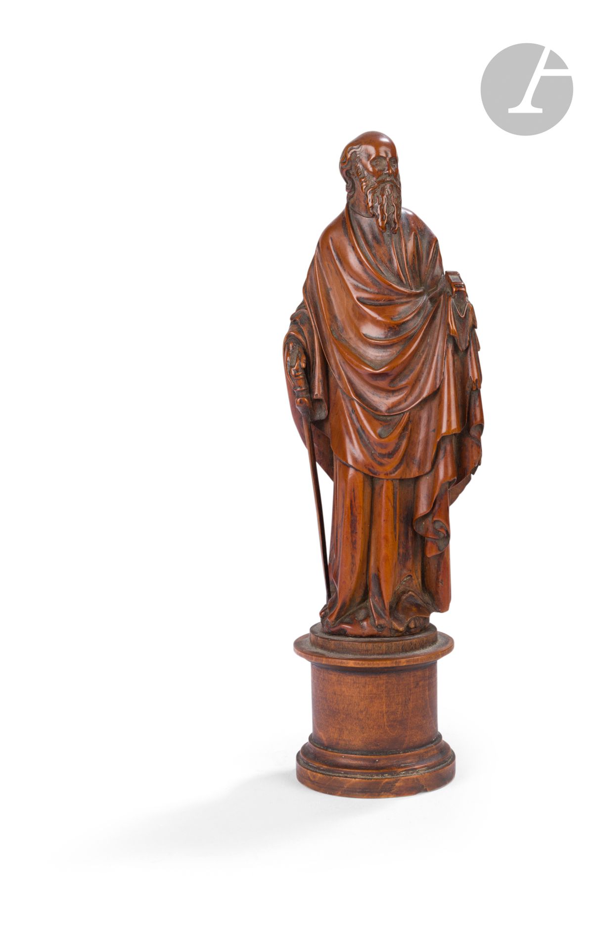 Saint Paul in boxwood, carved in the round. Standing with his head slightly turned, the apostle holds the sword of his martyrdom in his right hand and the book symbolizing his epistles in his left. He is dressed in a tunic and ample cloak, one side of which is pulled back in front and held by his left arm, forming wave-like folds and a highly architectural fall of folds on the side.
Flanders ? 17th century
H. 16 cm
(posterior blade)