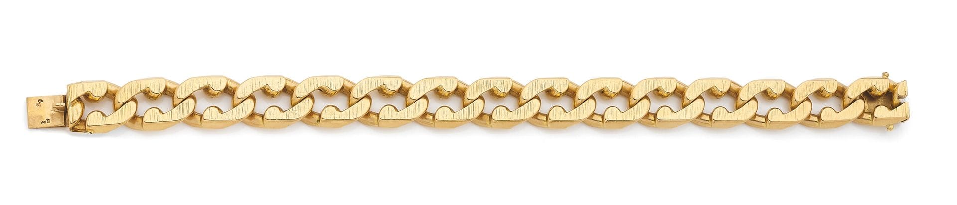 Bracelet en or 18K (750), articulé de maillons gourmettes guillochés. Dimensions: 20,5x1,2cm environ. Poids: 99,1g
A gold bracelet