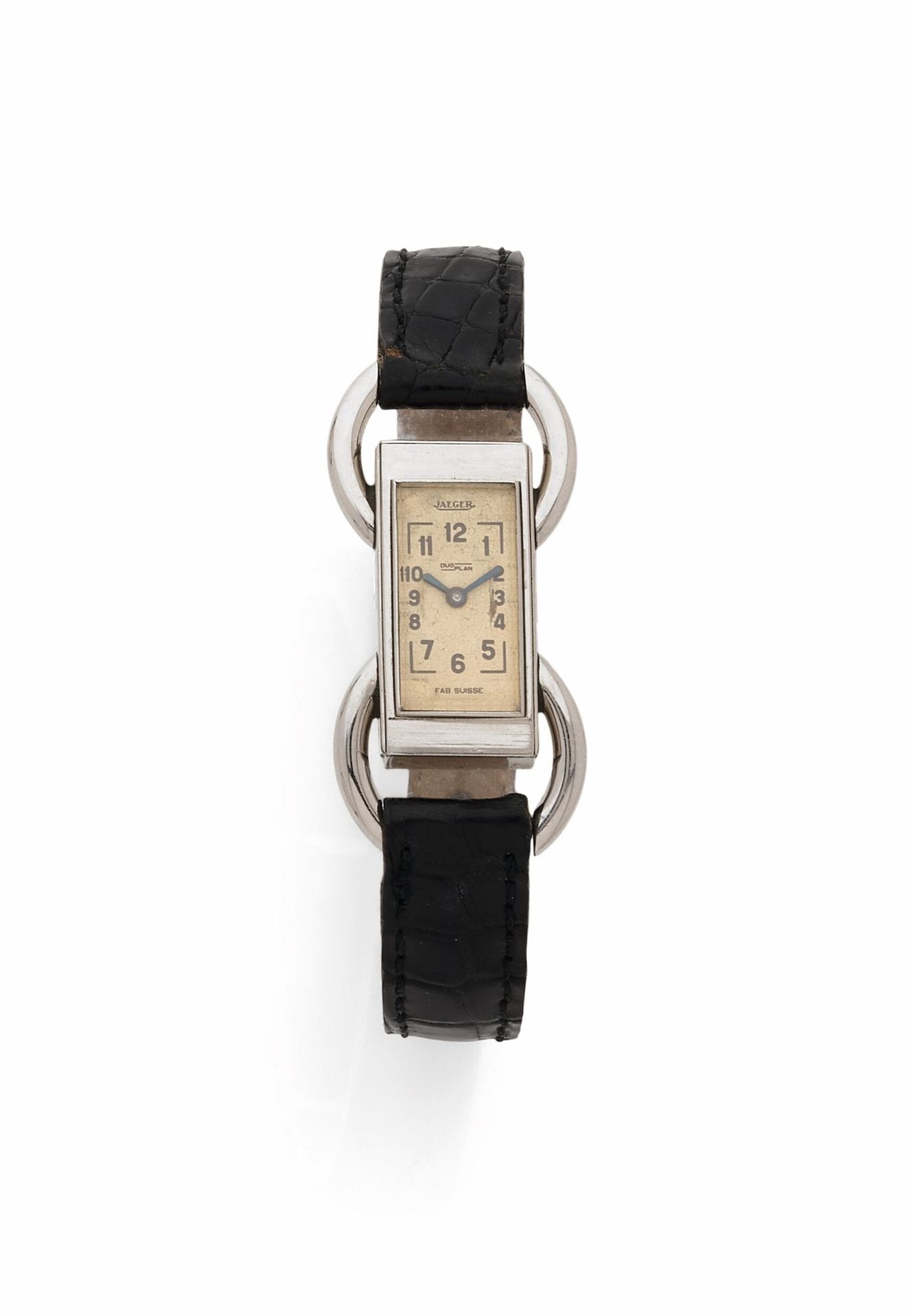 JAEGER
DUOPLAN
40'S
Steel bracelet watch on leather for export.
Case: rectangular, winder on back, oversized ring handles.
Dial: cream, Arabic numeral hour markers, blued steel sword hands, "Fab. Suisse".
Movement: mechanical, duo plan.
Strap: leather with steel pin buckle.
Signed and numbered 79890.
Dim. 26x12 mm