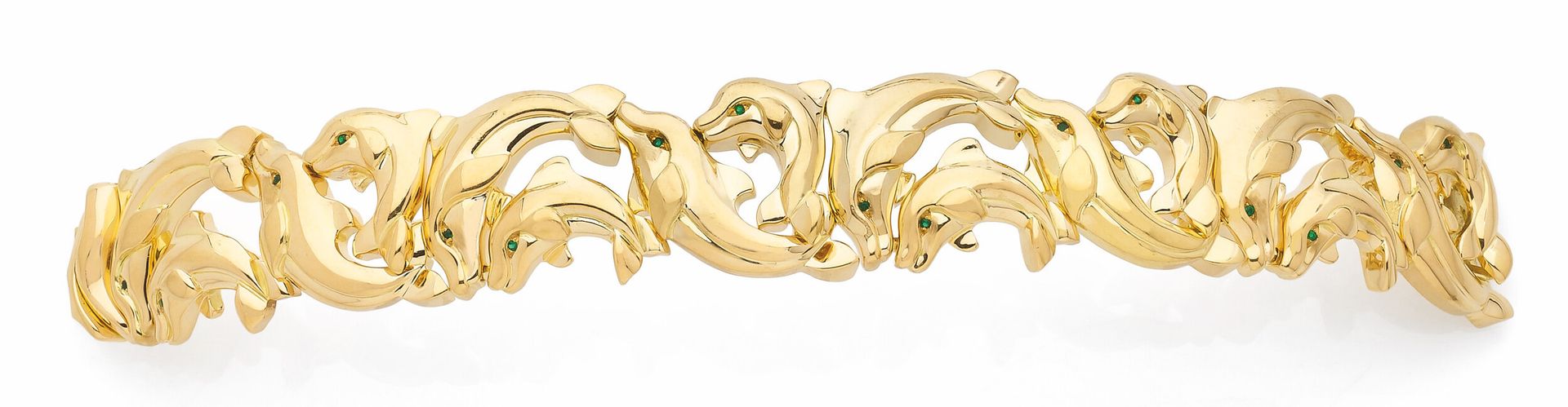 Bracelet en or 18K (750), articulé de dauphins, les yeux en émeraudes. Travail français. Dimensions: 17cm environ. Poids brut: 87g
A dolphin bracelet