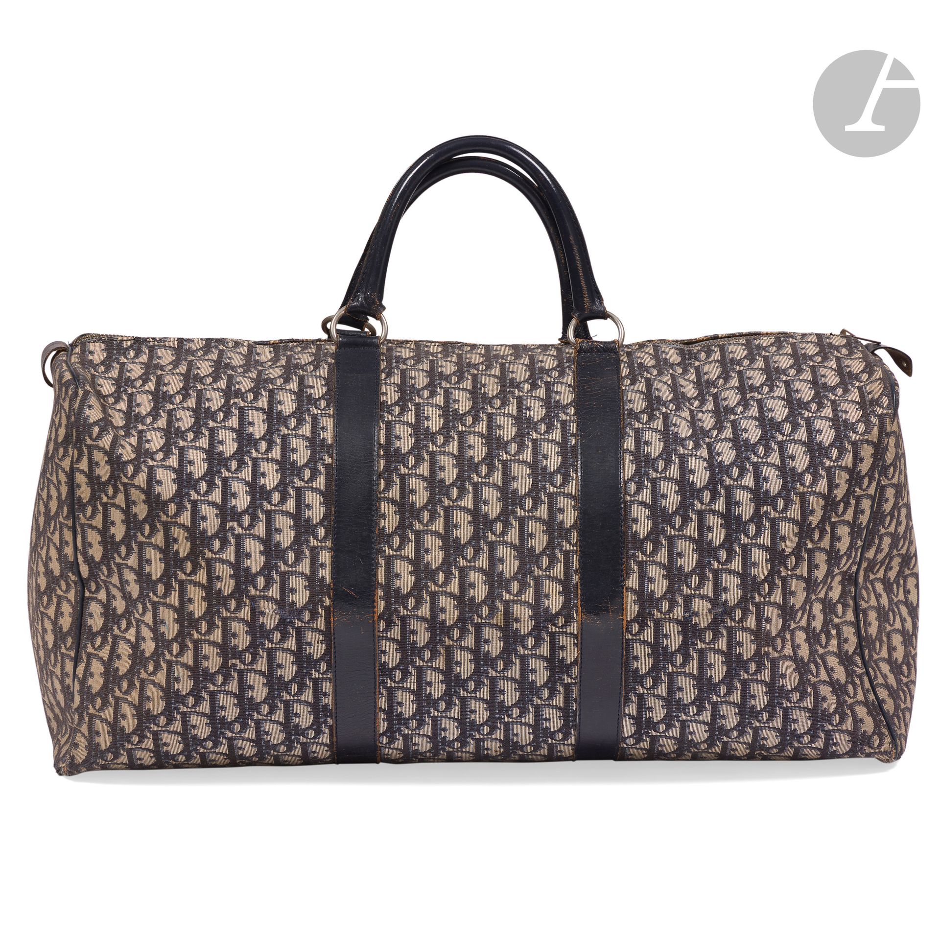 CHRISTIAN DIOR
Oblique canvas and navy leather travel bag. 55 x 38 x 21 cm
(wear and a few small accidents)