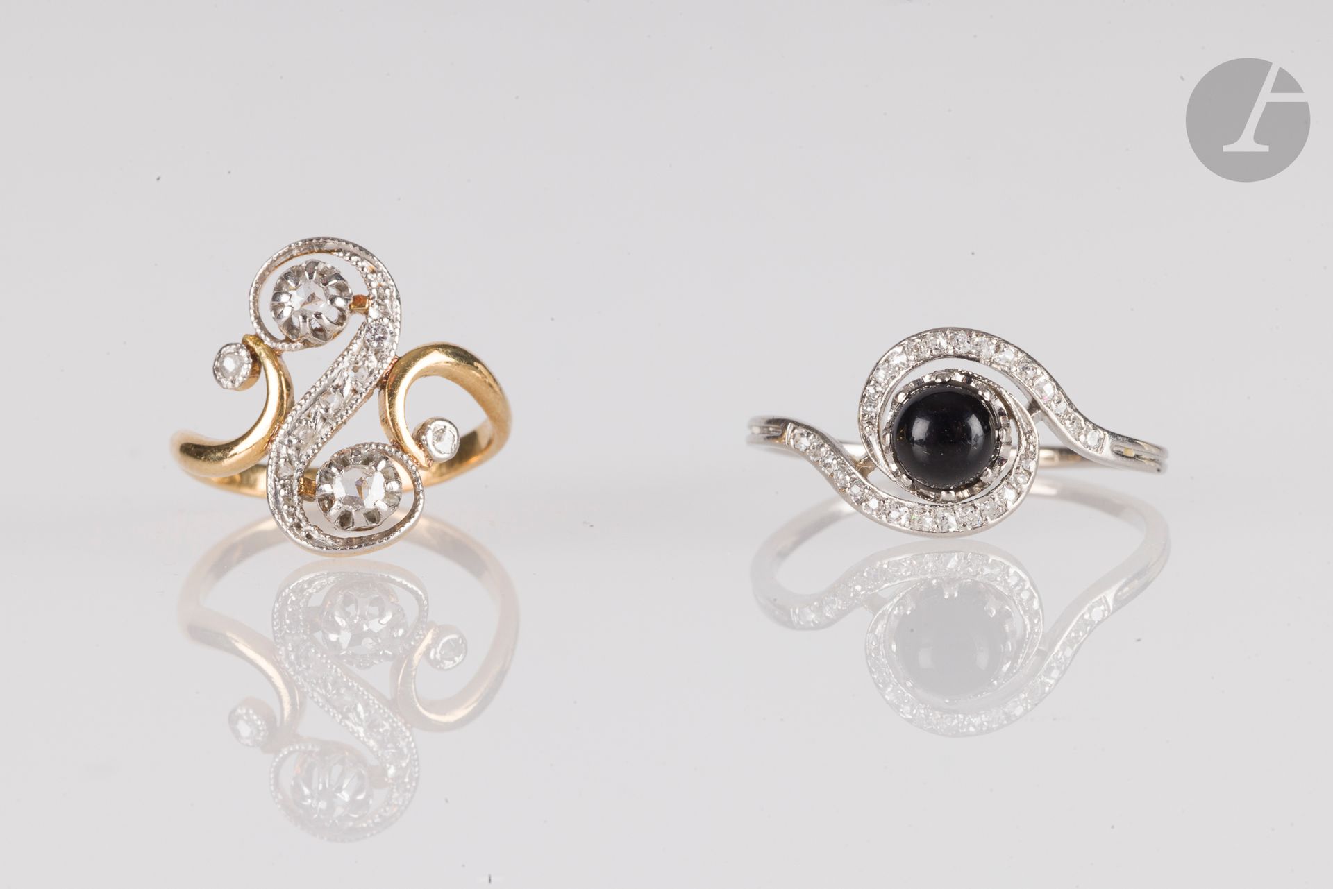Lot of two 18K (750) gold rings: one "tourbillon" set with cabochon onyx surrounded by old-cut diamonds; the other "croisée" set with rose-cut diamonds. Gross weight: 6 g