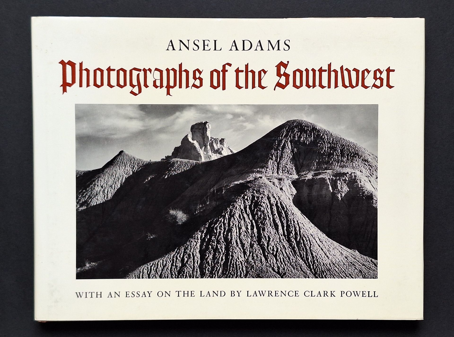 ADAMS, ANSEL (1902-1984) [Signed]
Photographs of the Southwest.
New York Graphic Society, Boston, 1976.
In-4 oblong (24 x 30 cm). First edition, signed by Ansel Adams. Photographs by Ansel Adams taken between 1928 and 1968 in Arizona, California, Colorado, New Mexico, Texas and Utah. Text by Lawrence Clark Powell. 128 pp. 109 photographs. Bound in brown cloth with gilt-lettered facsimile signature on 1st board, in illustrated dust jacket.