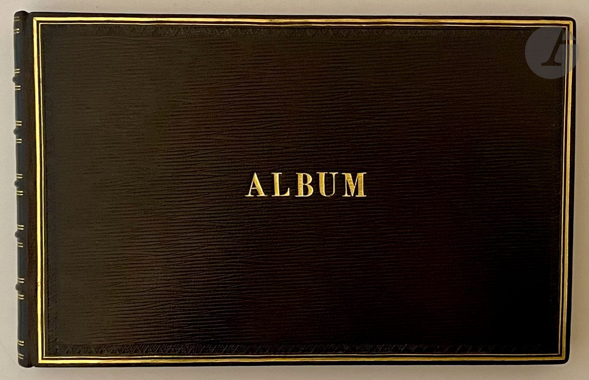 ALBUM DE DESSINS. S.l., between 1880 and 1900. In-4 oblong, long-grained dark blue morocco, double gilt fillet and cold-rolled border, word "ALBUM" gilt on center front cover, ornate ribbed spine, inner gilt border, red edges (modern pastiche binding). Superb album of over 100 drawings on more than 60 leaves, featuring numerous flowers, birds, country scenes and various ornaments. The album is dated 1884 and 1898. Most of the work was done in gouache and wash, but there are also some pencil portraits at the beginning of the book, including one of a sailor, as well as a few sketches. The birds are inspired by the work of Giacomelli. The compositions are not signed, but the name of Jeanne Gogefort (or Goyfort?) is inscribed in pencil at the beginning of the album. A very fine copy in a pastiche binding by Marc Ollivier.