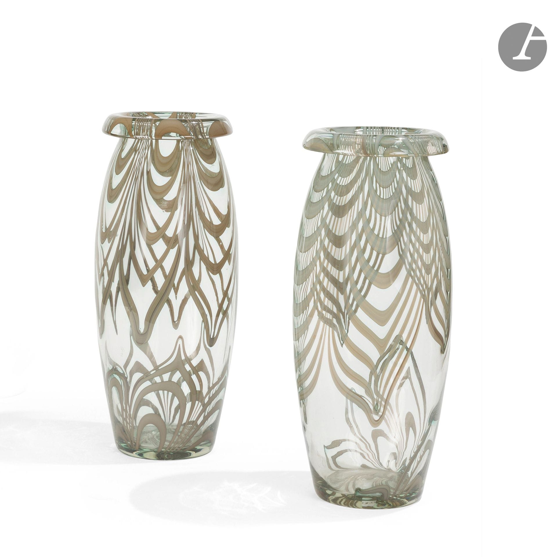 WOLFGANG VON WERSIN (1882-1976)
Paire de très importants vase ovoïdes à col ourlé. Épreuves en verre au décor mouvementé en inclusions. H. 35 cm 

Bibliographie et œuvres en rapport : 
Alfred Ziffer - Wolfgang von Wersin, 1882-1976 : vom Kunstgewerbe zur Industrieform - Catalogue de l'exposition itinérante organisée à la Villa Stuck, Munich (30 octobre - 8 décembre 1991) ; au Deutscher Werkbund, Francfort-sur-le-Main (31 janvier - 26 avril 1992) ; au Château de Pillnitz, Dresde (16 mai - 30 août 1992), Éditions Klinkhardt & Biermann, Munich, 1991. Nos vases à rapprocher des œuvres reproduites page 226.