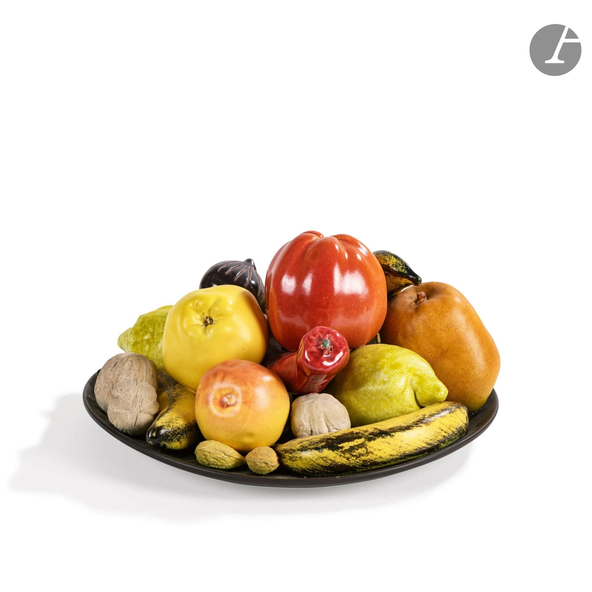 POL CHAMBOST (1906-1983) CÉRAMISTE & COLETTE GUÉDEN (1905-2000) CONCEPTRICE DU MODÈLE - COLLECTION PASCAL MARZIANO #2
Les Fruits
Rare plat circulaire au décor titre en ronde-bosse et en trompe-l'œil. Important et très rare plat aux fruits. Épreuve en céramique émaillée polychrome. Signé Poterie Pol CHAMBOST Made in France au revers. H. 16 cm - D. 28 cm

Historique : 
Exploitant le thème de la nature morte, Colette Guéden commandera à Chambost des compositions faites de fruits et de légumes en trompe-l'œil, en pyramide ou bien sur des assiettes. Ces dernières seront présentées lors de l'exposition La Clef des champs en 1958. 

Bibliographie et œuvres en rapport : 
Philippe Chambost - Pol Chambost. Sculpteur-Céramiste, 1906-1983 - Somogy Éditions d'Art, Paris, 2006. Des œuvres de la même série reproduites pages 124 et 148.