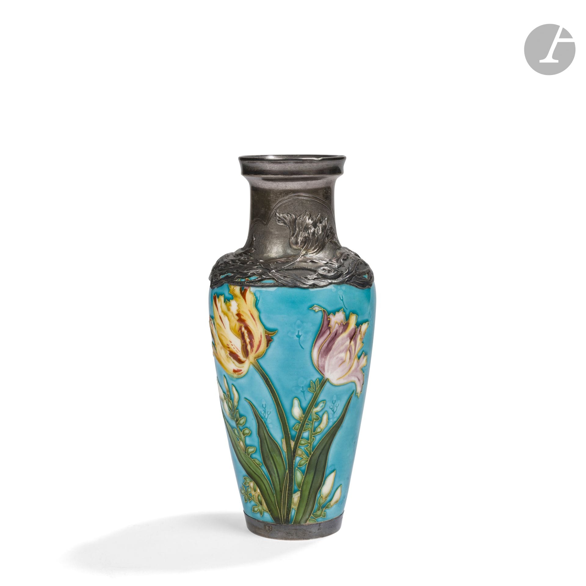 FÉLIX OPTAT MILET (1938-1911) CÉRAMISTE À SÈVRES & L. PRÉVOST (XIXe-XXe) CONCEPTEUR DU DÉCOR 
Tulipes perroquet
Vase balustre monté argent par Saglier orfèvre. Épreuve en céramique émaillée polychrome ; le décor floral polychrome traité à la façon d'un cloisonné sur fond bleu. L'importante collerette en argent repoussé au motif titre. Marqué du cachet oblong SÈVRES, cuit 96 sous la base, la base et la monture de col portent le poinçon de garantie, la monture de col celui de Maître Orfèvre. H. 24 cm