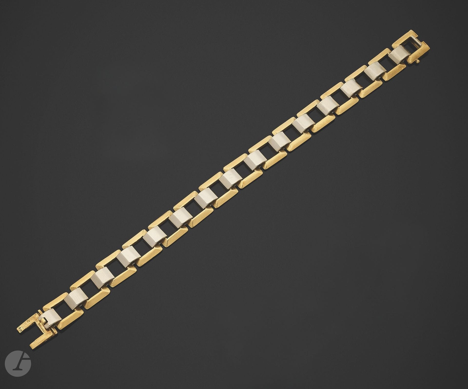 18K (750) gold bracelet, articulated by square links with 18K white gold bars. French work of the 1930s. Dimensions: approx. 20 x 1 cm. Weight: 35.3 g