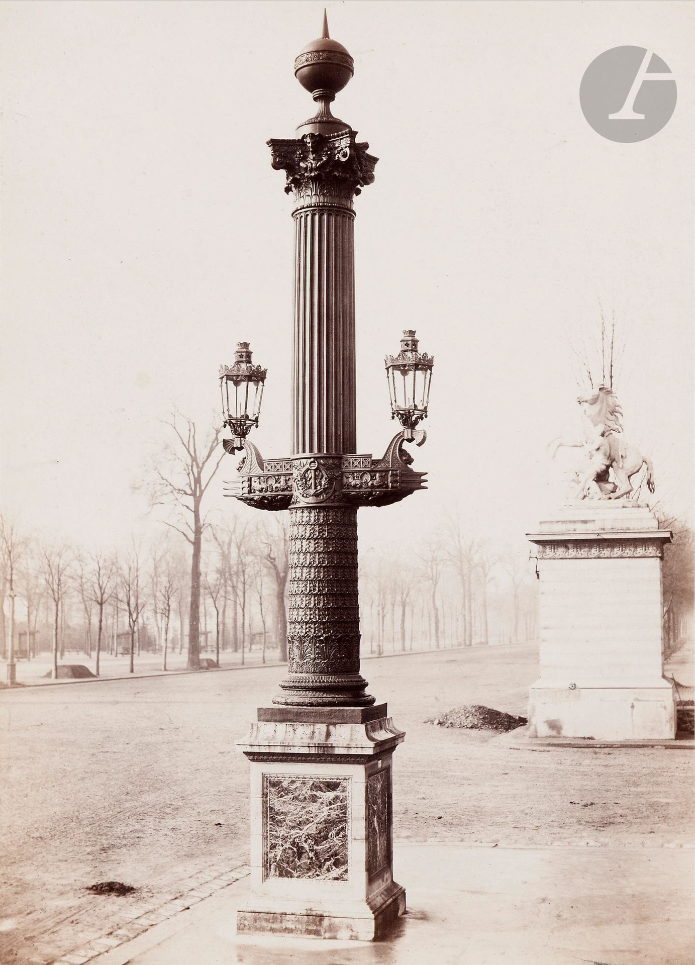 Charles Marville (1813-1879)
Rostral column from the Place de la Concorde. Paris, c. 1868-1870.
Albumen print, mounted on card and titled in ink on the lower mount label. Photographer's stamp on lower mount, hidden by label. Debuisson collection stamp on reverse of mount. 
36.8 x 26.5 cm