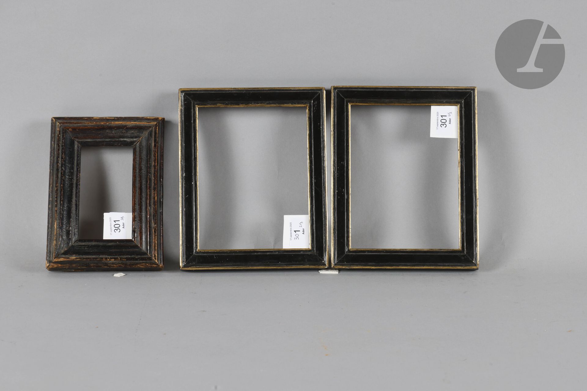 *Pair of black and gold molded wood frames. 19th century. 14.5 x 19 cm - Profile: 2.7 cm. A molded and stained wood frame. 19th century. 7 x 12.9 cm - Profile: 4.3 cm