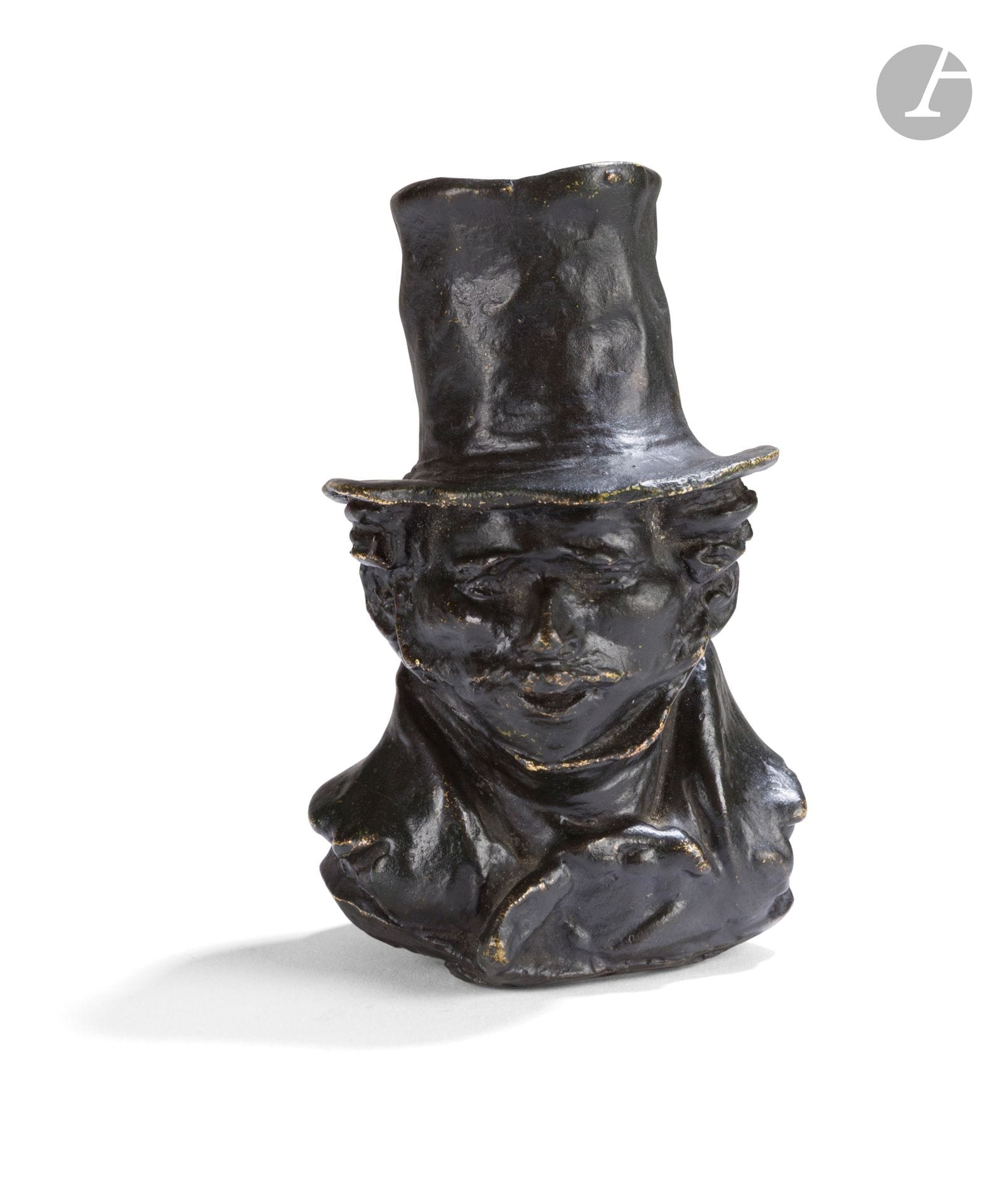 After Honoré Daumier (1808-1879)
Head of a man in a top hat
Small life-size bust in bronze with brown patina
Bears the initials "h.D" and a number that is difficult to read
H. 10 cm