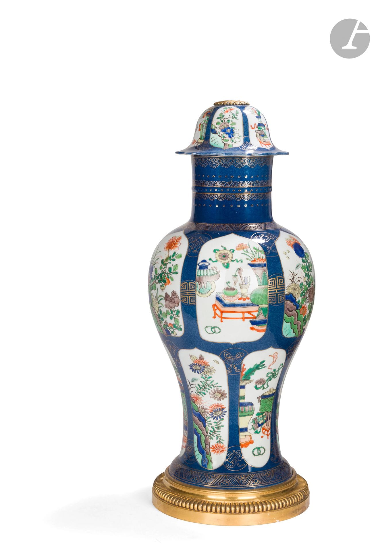 Green family Chinese porcelain lamp base, decorated with landscapes and utensils on a blue and gilt background, the gilt bronze base with gadroon decoration; (pierced for electricity).
Louis XVI style, late 19th century.
H. 66 cm