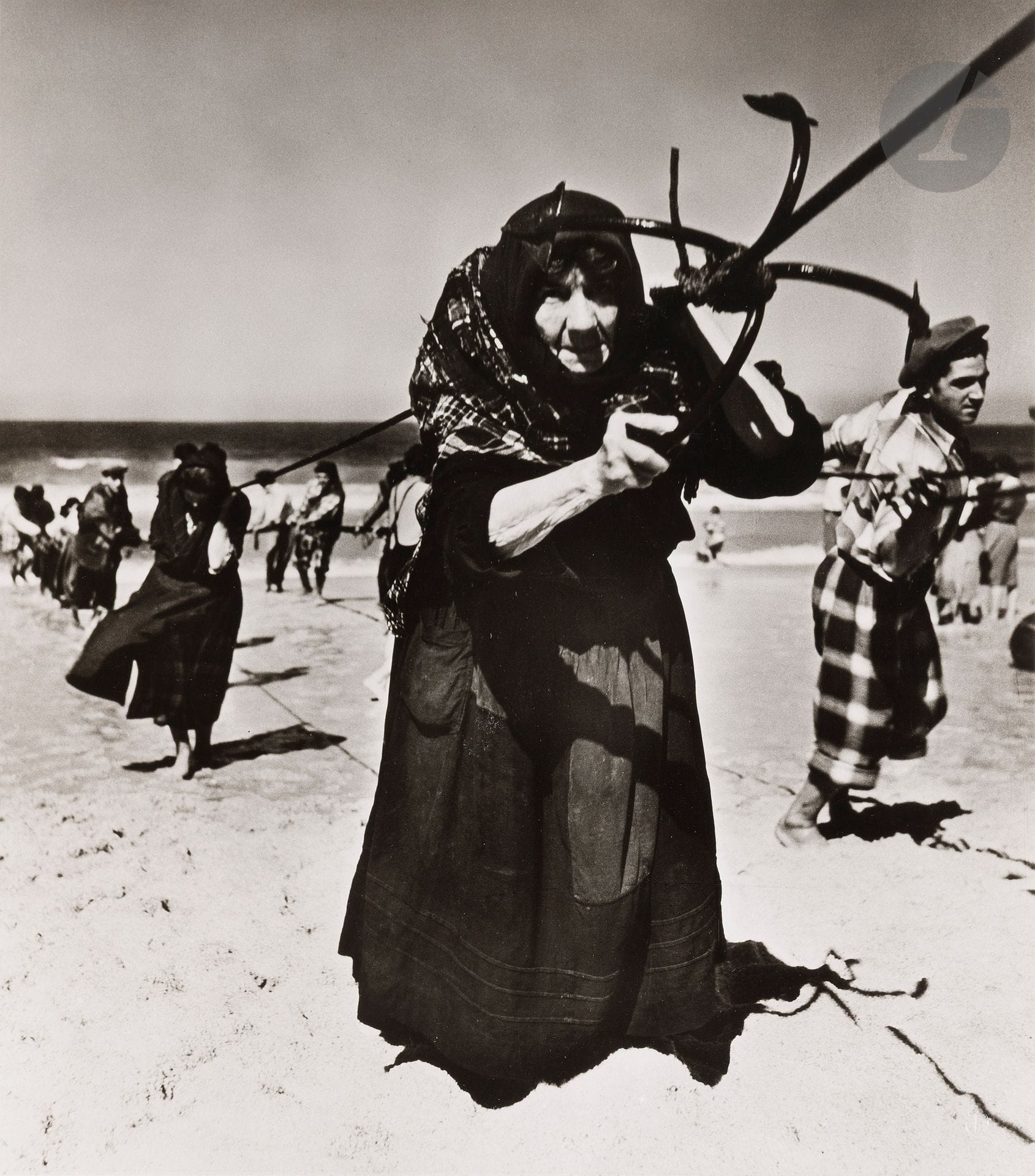 Jean Dieuzaide (1921-2003)
Pulling up the nets. Nazaré, Portugal, 1954. 
Two (2) silver prints on Agfa paper (printed by Jean Dieuzaide in 1979). Photographer's dry stamp lower right. Stamp "Photographed by Jean Dieuzaide", "Portugal" series stamp (N° 408), title and dates in pencil on versos. 
Images: 27.3 x 24 cm and 24 x 30 cm
Sheets: 40 x 30 and 30 x 40 cm